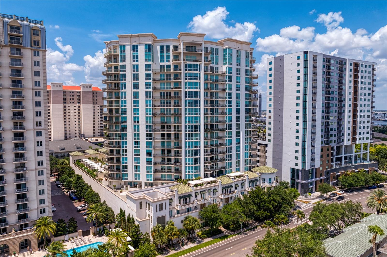 Downtown Tampa Luxury Condo Living with the WOW Factor you deserve! Tired of modern condos with predictable layouts & forgettable finishes? Look no further! Sitting 17 floors above Harbour Island with unobstructed southern views down to Hillsborough Bay, this custom-designed 3313 sqft condo is the perfect balance of modern elegance and artistic flair. Available FULLY FURNISHED! The open floorplan was designed to make ENTERTAINING feel effortless and memorable. From intimate dinners around the custom dining table, to evenings with a full house of friends, the natural flow and stunning views elevate the energy of any gathering. Espresso-colored porcelain floors anchor the main living areas creating a warm and cohesive feel. The custom bar area features a wine refrigerator, liquor drawers, ice machine, sink, beverage refrigerator, display shelves, bar stools, a pub table & chairs and designer lighting. Plus, the in-wall sound system provides high quality music throughout. Two large balconies give you the perfect spot to enjoy the sunrise to sunset views. The gourmet kitchen features wood cabinetry, KitchenAid refrigerator, range hood, convection oven, microwave, warming drawer & a breakfast nook. If you love to immerse yourself into movies or sports, the cozy & dark Media Room is the ideal retreat with surround sound, projector & 90" screen. The smartly-designed Owner's Suite includes a King-Sized sleeping area PLUS a built-in office area, 2 walk-in closets & a stunning bathroom that features an oversized Jacuzzi tub, 2 sinks, countertop storage cabinets & bidet. Ensuite #2 is privately located on the opposite side of the condo & has a King Sized bed, 2 closets, dual sinks, stunning stone countertops & a walk-in shower. The large Laundry Room includes a utility sink & tons of extra storage. Plus, the private lobby entrance ensures MAXIMUM SECURITY & PRIVACY! 2 Reserved Parking Spaces & Air Conditioned Storage Room also included. The Plaza at Harbour Island has set the gold standard for concierge condo buildings in the Tampa Bay Area. Enjoy the quiet, neighborhood-like feel of Harbour Island while also having easy access to all the exciting restaurants & events in Downtown Tampa! Residents of The Plaza enjoy 24-Hour Security, Concierge & Valet Service, a newly renovated Lobby & Amenities Floor featuring a Pool, Spa, Outdoor Grilling & State-of-the-Art Fitness Center. From the RiverWalk to Water Street, Downtown Tampa has grown into one of the most coveted cities to live and visit. Walk to hockey games, concerts, parks, events & some of the best restaurants in town! Right across the street from LifeTime Fitness Center with tons of tennis & pickleball courts.