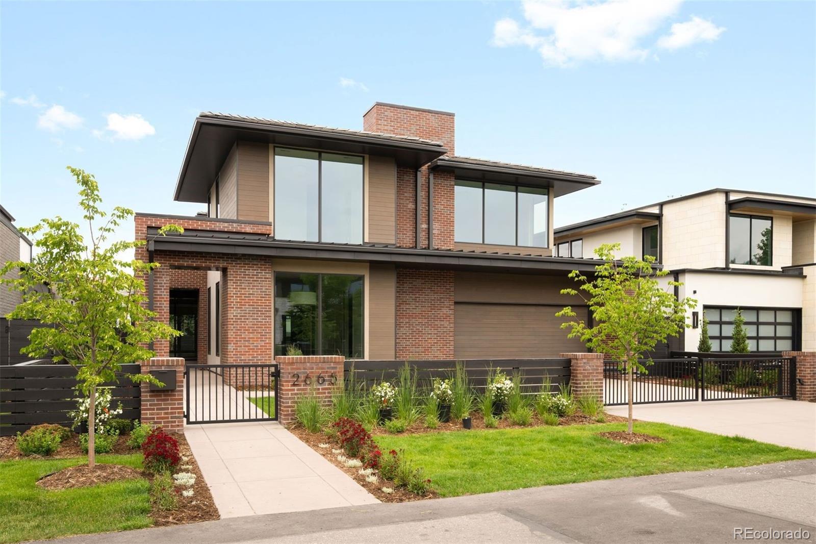 Behind a striking contemporary façade in the heart of Cherry Creek, this newly constructed residence offers a rare combination of architectural sophistication, exceptional scale, and resort-inspired living, highlighted by a private pool rarely found in the neighborhood. Designed around seamless indoor-outdoor connection, expansive walls of glass and Nano doors open the main living spaces to covered outdoor lounges and the resort-style backyard, creating an effortless setting for both everyday living and entertaining. The kitchen serves as the heart of the home, beautifully appointed with dual dishwashers, separate Thermador refrigerator and freezer columns, a Bertazzoni oven, hidden pantry, natural stone surfaces, custom cabinetry, and an oversized center island where family and guests naturally gather. Adjacent dining and living spaces flow effortlessly to the backyard, where the pool, outdoor fireplace, and generous patio spaces create a true extension of the home. A rare offering for Cherry Creek, the main level features two private suites, including a luxurious primary retreat with a fireplace, spa-inspired bath, expansive custom closet, and direct access to the backyard. Upstairs, three additional en-suite bedrooms are complemented by a spacious loft, ideal as a secondary family room, study space, or media lounge. The fully finished lower level is designed for recreation and relaxation, featuring a large entertainment room with wet bar, game area, dedicated wine tasting room and wine storage, fitness studio, guest suite, and extensive storage. Just moments from Cherry Creek's designer boutiques, acclaimed dining, galleries, and cultural experiences, this address combines the best of Denver living with the rarity of brand-new construction.