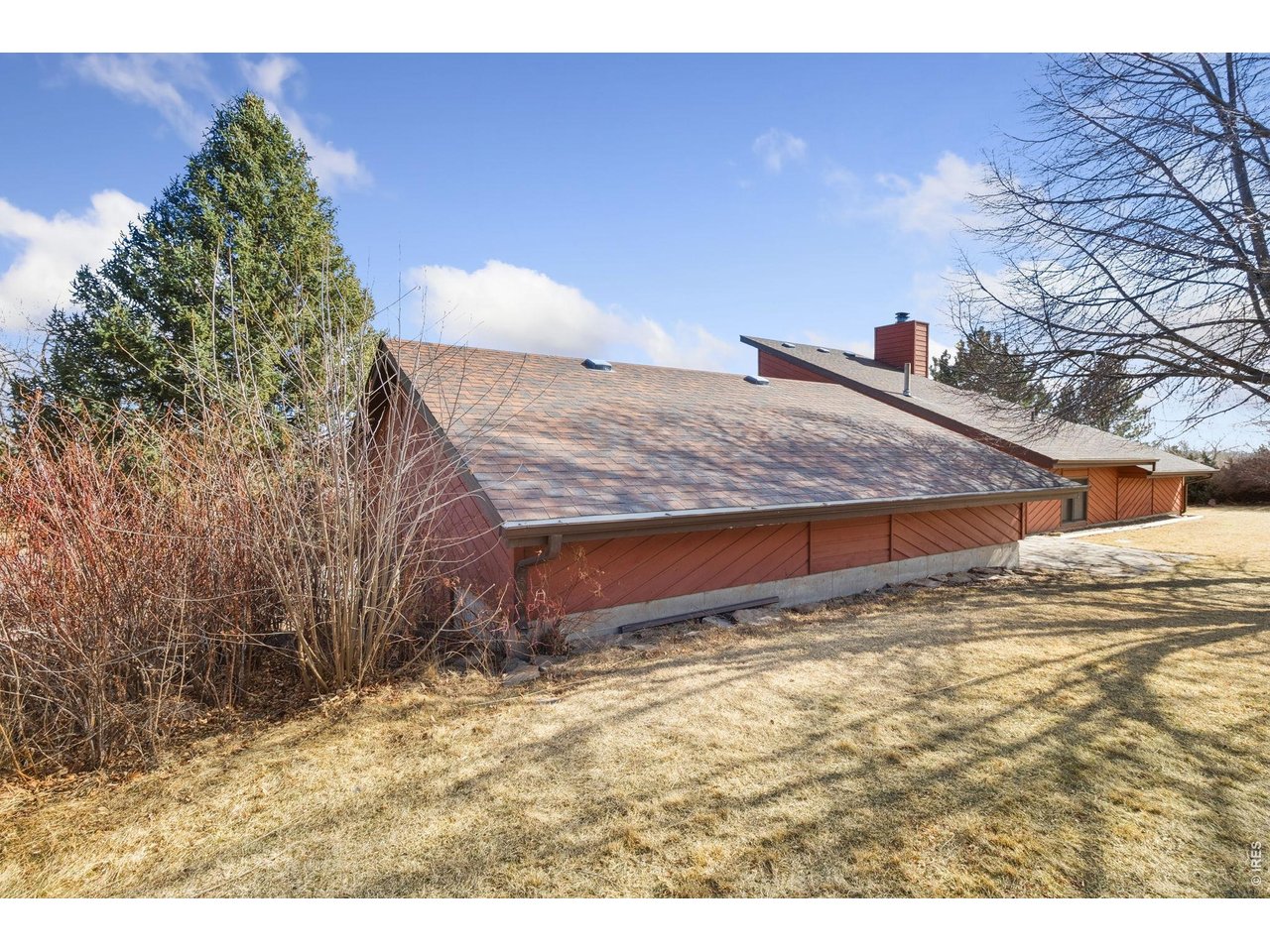 Tucked into the picturesque foothills of Loveland, this charming 3-bed, 2-bath ranch offers 1,900 sq. ft. of thoughtfully designed living on a private .68-acre lot. The vaulted living room-with its warm wood-burning fireplace-flows seamlessly into the dining room and kitchen, creating a bright and inviting space for gatherings. The spacious primary suite includes access to the sunroom and an ensuite bath. Enjoy sweeping views of Loveland from the top of the property, along with the peaceful seclusion that comes from a very private setting with no HOA. Additional highlights include a new roof, proximity to shopping, dining, and miles of hiking and biking trails, plus the confidence of being pre-inspected and offered with a 1-year home warranty.