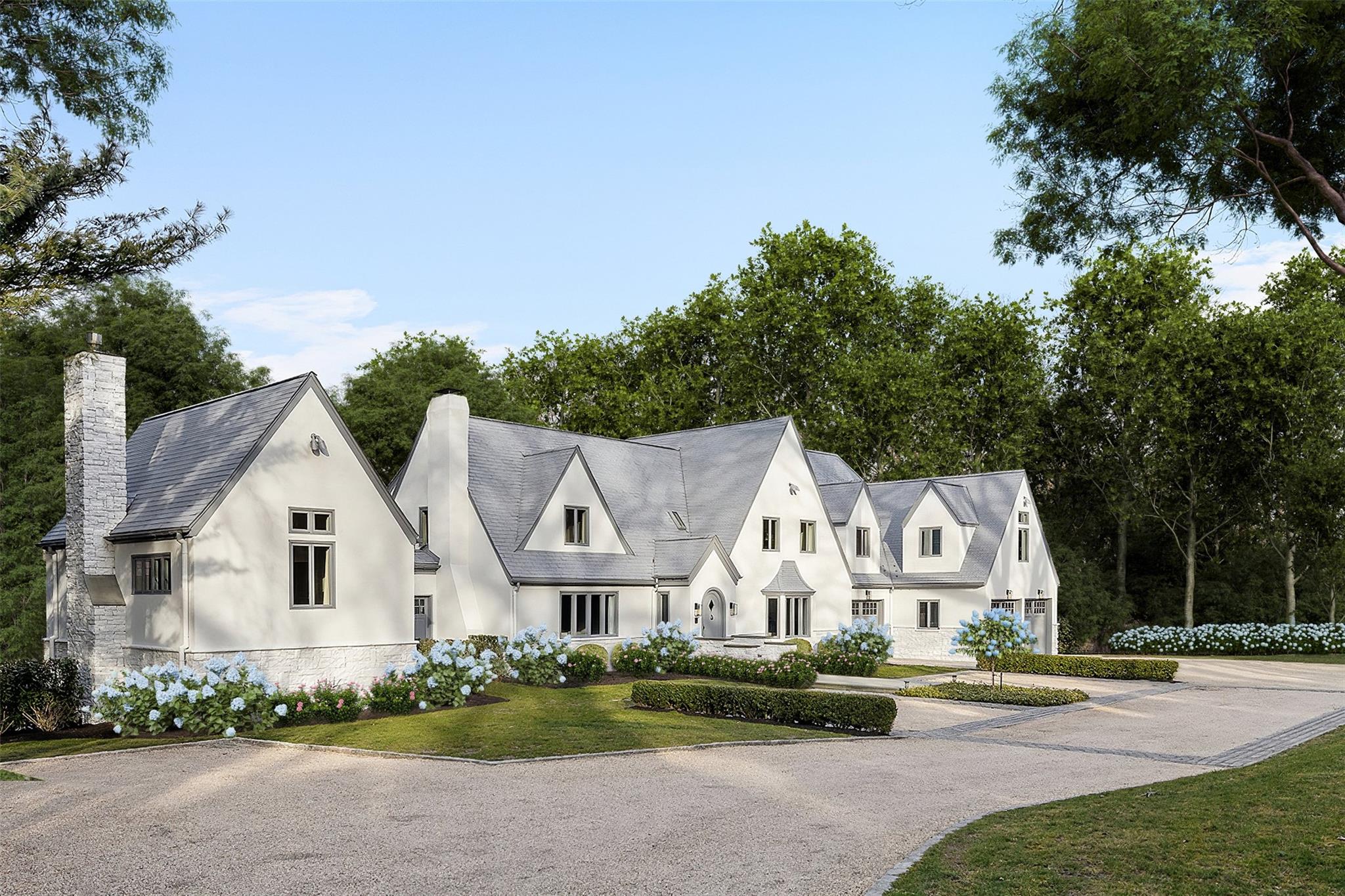 344 Millstone Brook Road is a newly renovated, expansive Hamptons oasis providing maximum privacy, comfort, and lifestyle. Set on a generous private flag lot at a high elevation, it boasts stunning mature perennial landscaping and meticulously maintained grounds, offering breathtaking natural views and plenty of sky.

Fully renovated and flanked by a large equestrian estate and a protected nature preserve, this exceptional property creates a tranquil, protected environment for generations to enjoy.

Located in one of the most secluded yet convenient enclaves, it provides easy access to beaches, marinas, golf courses, and villages—all tucked away behind three world-class golf courses and away from the hustle and bustle of village traffic.

Boasting an impressive solidly constructed 9,500 square feet of finished living space, this newly renovated bespoke villa features six en-suite bedrooms, three half bathrooms, and an array of graciously proportioned living areas, including multiple guest suites, dining room, living room, family room, screened porch, poolside lounge, billiards room, screening room and more. 

The chef's kitchen is a culinary masterpiece, complete with three sinks, Wolf, Subzero, and Kalamazoo appliances, butler's pantry, wet-bar, custom white oak cabinetry, and a stunning Tuscan-white waterfall marble island. The dining area features a center fireplace opposite the breakfast area overlooking the breathtaking nature preserve. 

Step outside into the screened-in porch, where eight operable skylights illuminate the space overlooking the pool where an outdoor kitchen with Kalamazoo BBQ and wine storage await. The terrace offers a picturesque view of the protected forest and glimpses of nearby horse pastures, with access to the sparkling gunite pool and brand-new white stone pool patio. 

Retreat to the regal primary suite, featuring vaulted ceilings, a large sitting room/home office, double bathrooms and dressing rooms, a steam sauna, power shower, and a deep therapeutic whirlpool tub. Additional luxurious amenities include a salt water hot tub, dry sauna, multiple fireplaces, and seven zones of central air and hydronic radiant floor heat in every room. 

The connected pool house is a true oasis, complete with a cedar sauna, workout area, and king-size master en-suite bedroom with a poolside lounge and double doors leading to the patio. The finished basement offers ample space for entertainment, with a large screening room, lounge, and billiards area. 

This gated flag lot is perched atop a hill, offering complete insulation from the outside world with security cameras and custom night lighting. The three-stall heated garage and private motor court comfortably accommodates 16 vehicles. 

Experience the best of both worlds with this exceptional property, just 90 minutes from Midtown Manhattan, eight minutes to Southampton Village, 10 minutes to Flying Point Beach, and within minutes to Peconic Bay, Bullhead Bay Yacht Club, and three world-class golf courses, including Shinnecock Hills, The National Golf Links of America, and Sebonack Golf Club. Call today for more information or to schedule a private tour.