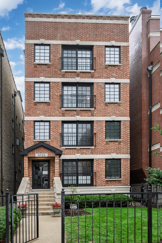 Stunning top-floor Wrigleyville condo! Bathed in natural light and tucked in an intimate building on a one-way street (not on the EL side), this home boasts an open layout with a spacious living and dining area and a large, well-appointed kitchen. Sophisticated touches include crown molding, a custom fireplace mantle, and gleaming hardwood floors throughout. The primary suite features a dual vanity, steam shower, and soaking tub. Enjoy private roof rights, an attached garage parking spot, in-unit laundry, abundant storage, and low assessments. Steps from Wrigley Field, Whole Foods, restaurants, shops, the lake, and CTA-urban living at its finest!