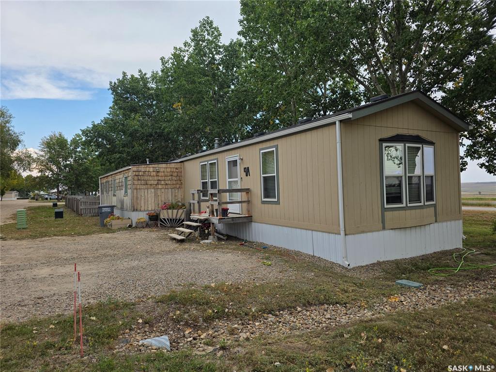 This 2007 original-owner mobile home at 9A Prairie Sun Court, Swift Current, SK is a comfortable and affordable option for anyone wanting a place that’s easy to maintain yet full of perks. With 2 bedrooms and 2 bathrooms, and an open design kitchen/dining/living room, it’s a layout that makes sense—whether you’re downsizing or just starting out. The unheated side porch gives you that extra bit of flex space for storage, a summer hangout spot, or even a place to pot plants when spring rolls around. Step outside and you’ll find a fully fenced backyard, offering both privacy and a safe space for kids, pets, or your next backyard barbecue. And for the handy or hobby-minded, there’s a powered 12x20 workshop tucked out back, making it easy to get creative, fix things, or simply have a little getaway spot without leaving home. Sitting on a rented lot, this property keeps things budget-friendly while still delivering the independence and outdoor space you’ve been looking for.