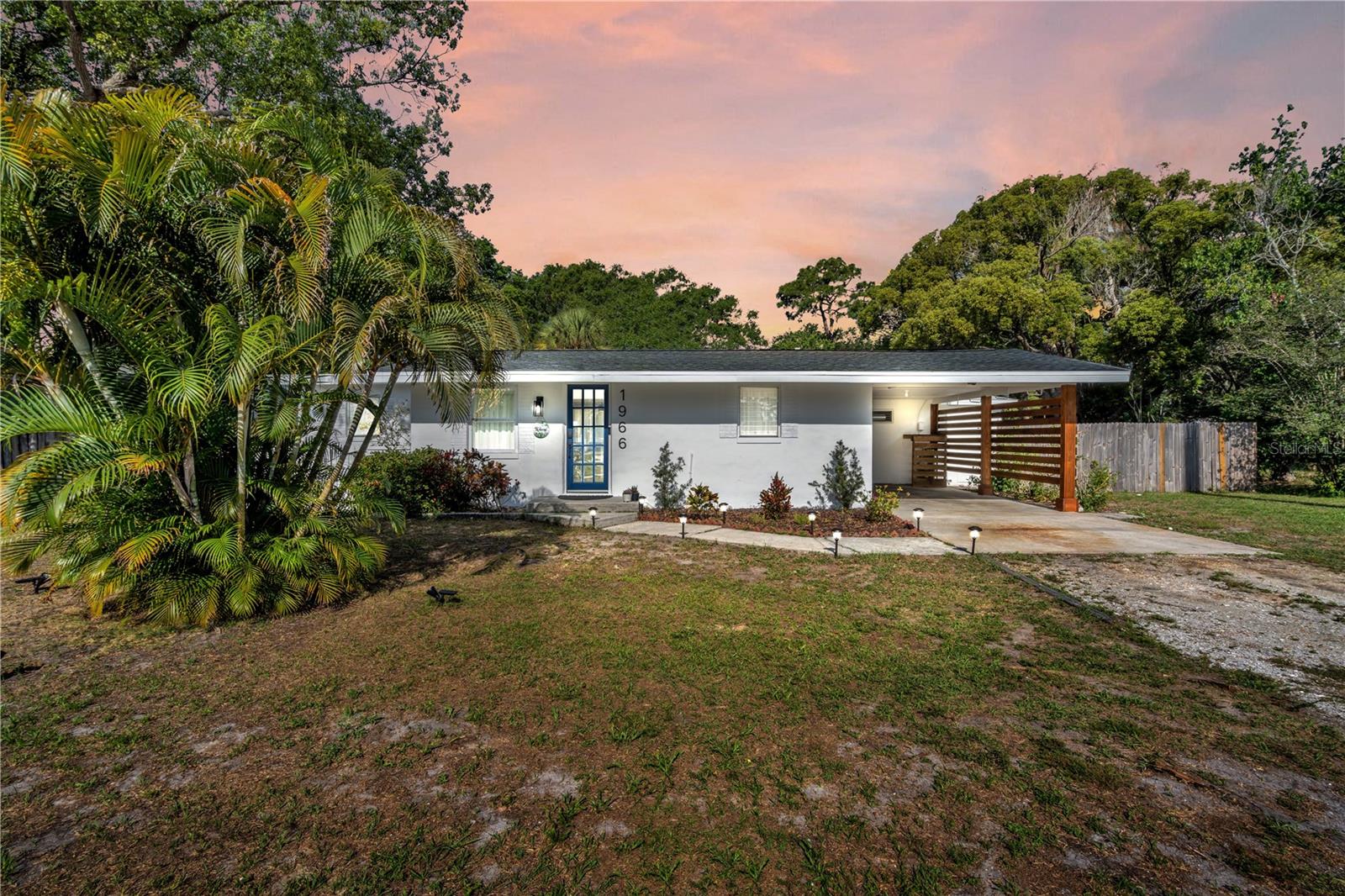Completely renovated just three years ago, this 3 bedroom, 2 bathroom block home sits on an oversized lot in the heart of Largo with rare flexibility, outdoor space, and income potential. The interior was thoughtfully updated throughout, including a new AC unit and hot water heater. The kitchen features new Samsung appliances, durable porcelain slab countertops, quiet-close cabinetry, a stainless steel single basin sink, and Delta faucet. Both bathrooms were updated with new tile showers, vanities, toilets, and Delta fixtures. Additional interior upgrades include ceiling fans with remote controls in every room, a dedicated laundry room with new Insignia washer and dryer, Frontier 1GB fiber internet, Schlage smart locks, and Blink security cameras. Outside is where this property truly stands out. Situated on over a quarter acre, the backyard was designed for entertaining and enjoying the Florida lifestyle with a hot tub and deck, fire pit area with pavers and decorative rock, dog play area with artificial turf, and new privacy fencing around both the backyard and carport. With room to expand or add an ADU, plus the ability to operate as a short term rental in Largo, this property offers a unique opportunity for both homeowners and investors alike. Roof replaced in 2022.