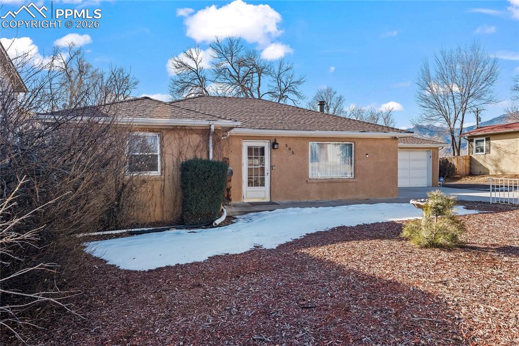 305 W. Brookside St. is truly a one-of-a-kind property that must be seen in person, to be properly appreciated. This 1950s stucco rancher sits on a massive 15,150 square foot lot right in the heart of West Colorado Springs. Just minutes from Downtown, I-25, Bear Creek Park, Cheyenne Mountain, Red Rocks open space and walking distance to the beloved Ivywild School, this location is close to premier entertainment, restaurants, breweries AND the premier outdoor trails and mountains that make Colorado so special. Main level living ranch style home with a floor-plan that offers extreme versatility. Full finished basement with kitchen space and separate entrance through the attached 2-car garage. This property functions wonderfully as a singe-family home but is also primed and ready for roommate or duplex income. The interior is ready for you to put your personal touches on this classic home. A few updates to match the charm of the original hardwood floors and vintage lighting, and this home will very quickly and easily be a masterpiece! The lot is over a 1/3 or an acre with plenty of off-street parking out front for boats or R/V's. And a backyard that usually only exists in fairy tales or our wildest dreams with mature trees, meticulously maintained landscaping, storage sheds, and a few special out-buildings that provide a perfect man-cave/she-shed get away right in your backyard. I promise, you will not want to leave this backyard, and with the functional exterior outhouse, you won't have to! It is not everyday a property or an opportunity like this presents itself, come have a look!