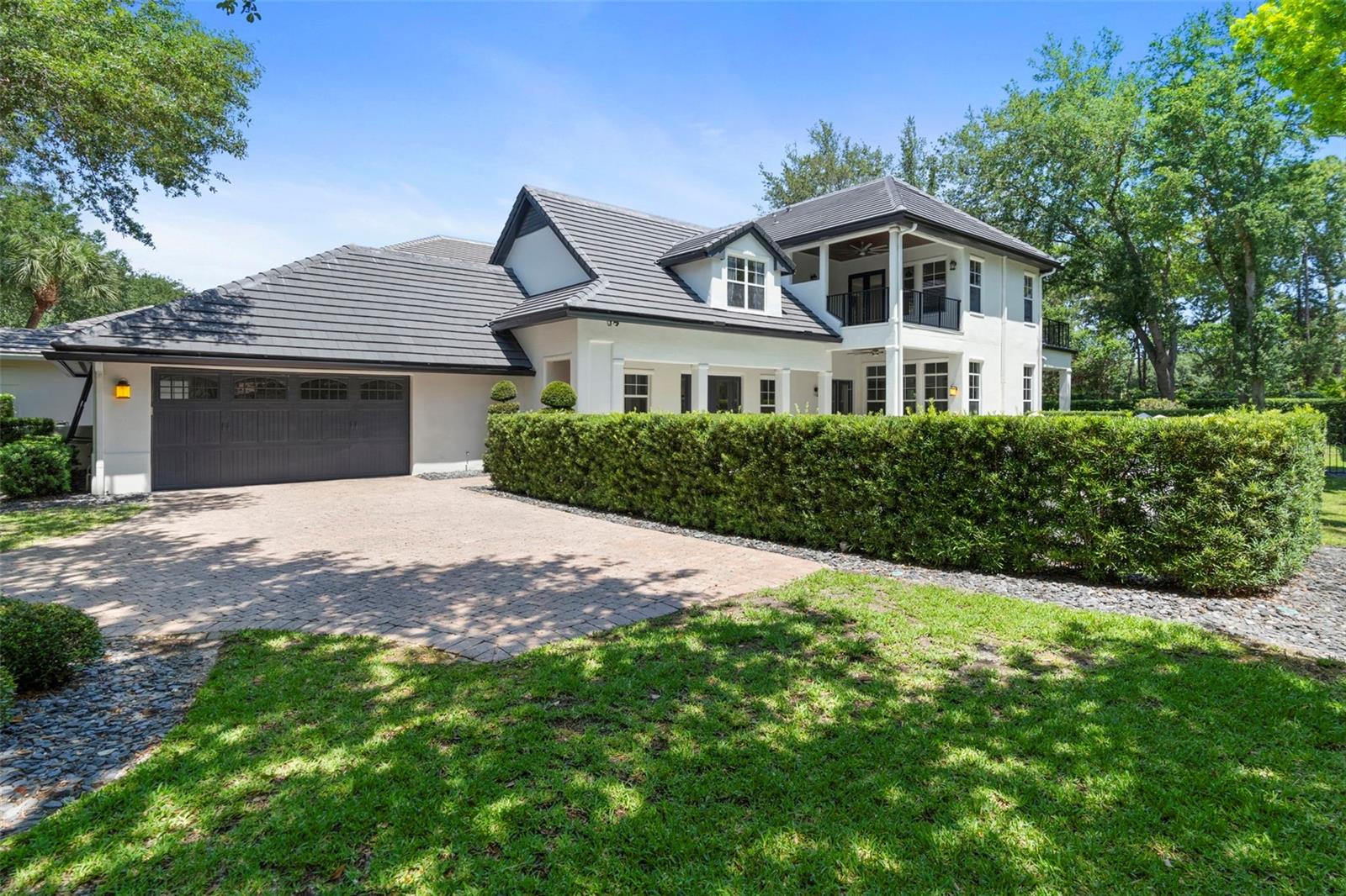 Under contract-accepting backup offers. This beautiful pool home has a new tile roof with transferable warranty and it sits on an oversized corner lot in the well-known gated community of Lake Nona Golf & Country Club, which is admired by many golf lovers including top players and legendary professionals.  This home offers oversized double master suites on the first and second levels overlooking the wide courtyard.  Both have a spacious bedroom, luxury full bathroom, and oversized walk-in closets. There is a large living room with custom shelves on the first floor with the covered back porch and big yard There is a large game room with two balconies facing the wide courtyard on the second level. One is covered and overlooking the private pool with spa while the other is overlooking the courtyard from the second level. The 3rd bedroom on the 2nd floor has a full bathroom and a spacious walk-in closet. The kitchen with marble countertops & backsplash is equipped with the gas stove, double ovens, microwave, hood, oversized refrigerator, wine cellar, extra refrigerator and freezer, big sink with disposal, dishwasher, and pantry.  The Dining room is off the kitchen and invites the guests on the pool deck by the courtyard entry for fun gatherings. The brick driveway leads to a two car garage with an additional golf-cart storage space as well as to the courtyard entrance by the pool deck. Two HVAC systems were upgraded entirely in 2023 with UV air quality enhancement, whole home duct cleaning, and sanitizing. Water supply pipes were re-piped to PEX "A" type in 2024 to ensure the healthy living.
