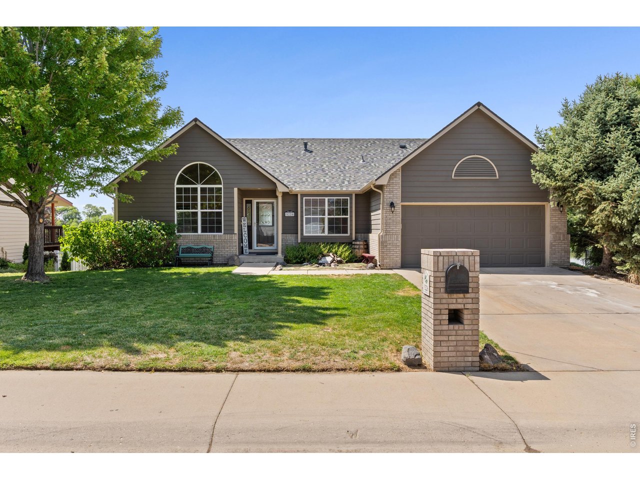 Pond views, main-level living, and a finished walkout basement make this T-Bone Ranch home stand out. This ranch-style home offers peaceful water and mountain views from both the main deck and the private deck off the primary suite, giving you multiple places to sit outside and enjoy! Inside, hardwood floors, vaulted ceiling, and a fireplace create a warm and inviting main living space. The home has also been refreshed with brand-NEW carpet in the upstairs bedrooms and fresh interior paint throughout much of the home. The kitchen features stainless steel appliances and opens nicely into the main living areas. Downstairs, the finished walkout basement gives you plenty of additional space to spread out, including a built-in bar and entertainment area that's perfect for hosting, watching the game, or relaxing. Outside, you'll find a fenced backyard, built-in storage underneath the deck, and great views of the pond. A NEW roof was installed in 2025, and the home also features a solar lease to help keep electric costs down. With an attached 2-car garage, central A/C, a low HOA fee, and a convenient location just minutes from Centerplace, shopping, restaurants, parks, and other everyday amenities, this home offers a great combination of space, updates, and location!
