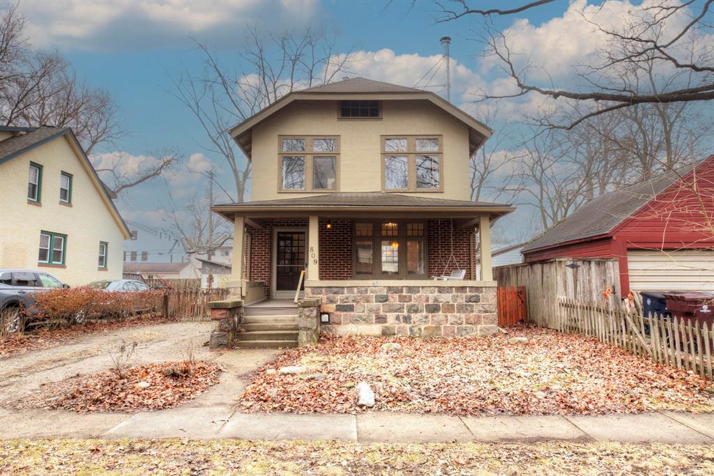 Welcome Home to this beautiful brick and stucco historic home in the highly sought after Lower Burns Park! Walk up to your large, covered front porch with Trex boards, and relax on your swing while overlooking your quiet street. Step through your stunning front door into your charming foyer as you are greeted by the incredible character of your 1925 home. Inside you'll find original woodwork, high ceilings, hardwood floors, and recently refurbished original wooden windows letting natural light into every room. Your spacious living room flows right into your picturesque formal dining room, both having ideal outdoor views. Your kitchen showcases ample storage, a newer gas cooktop, an incorporated cutting surface, and retro-styled cabinets. It conveniently attaches to your dining room as well as your exterior side door for easy access to bringing in groceries. Upstairs you'll find your gorgeous, updated bathroom with attractive design choices and a double sink.Your massive primary bedroom features built-ins and multiple closets including a massive walk-in area, and can be converted back into two separate bedrooms if wanted. Your secondary bedroom overlooks your private backyard and can be used as a guest room, office, or whatever you desire. There is an additional finished room in the basement that can function as an office, craft room, workout space, etc as well. The downstairs unfinished spaces include a roomy laundry area, and a utility room with good-sized storage capacity and a workbench. There is additional storage in your backyard shed, which can easily hold plenty of gardening supplies to work in your raised garden beds. On top of your included rain barrel and compost bin, the sellers are willing to leave behind the electric lawn mower, gardening equipment, outdoor furniture, and grill at no cost. Your sizable backyard is fully fenced in and has a brick patio as well as a firepit that are perfect for hosting. Enjoy your friendly neighborhood and take advantage of your unbeatable location by walking to restau