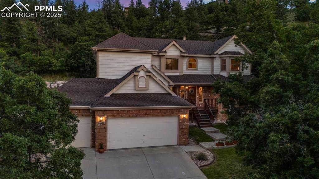 Remodeled to perfection, this Northwest Colorado Springs gem offers a chef’s kitchen, spa-worthy bathrooms, and a private backyard—moments from Woodmen Roberts Elementary. Located in top-rated Academy District 20, this beautifully updated home sits in a quiet cul-de-sac, offering both privacy and neighborhood charm. The fully remodeled kitchen boasts tile flooring, island, pantry, and all newer appliances, and flows seamlessly to the sunny dining space and outdoors. Step outside to a secluded yard with mature trees going up the hillside, and a partially covered stamped concrete patio—perfect for weekend barbecues, quiet morning coffee, or evening gatherings under the stars.

Inside, every bathroom has been thoughtfully renovated with high-end finishes. The main level offers formal living and dining rooms, a cozy family room with a brick fireplace and wall of windows flooding the space with natural light, and a versatile main-level office (or bedroom) with an adjacent remodeled ¾ bath. 

The luxurious primary suite features a bay window and a spa-like bathroom with quartzite countertops, heated tile floors, dual sinks, and a walk-in closet. Also upstairs you’ll find three additional spacious bedrooms and a beautifully updated full hall bath with dual sinks and a large linen closet. Throughout the home, details like newer carpet, wrought iron staircase railing, and modern lighting add style and warmth. A spacious main-level laundry room with storage, a 3-car garage, and a brand-new 200-amp electrical panel provide convenience and peace of mind.

Neighborhood parks are just a short stroll away, and the location offers quick access to shopping, dining, outdoor recreation, and I-25 for an easy commute anywhere in town or Denver. Experience the perfect blend of privacy, neighborhood charm, and modern updates in one of the city’s most sought-after locations—schedule your private showing today!