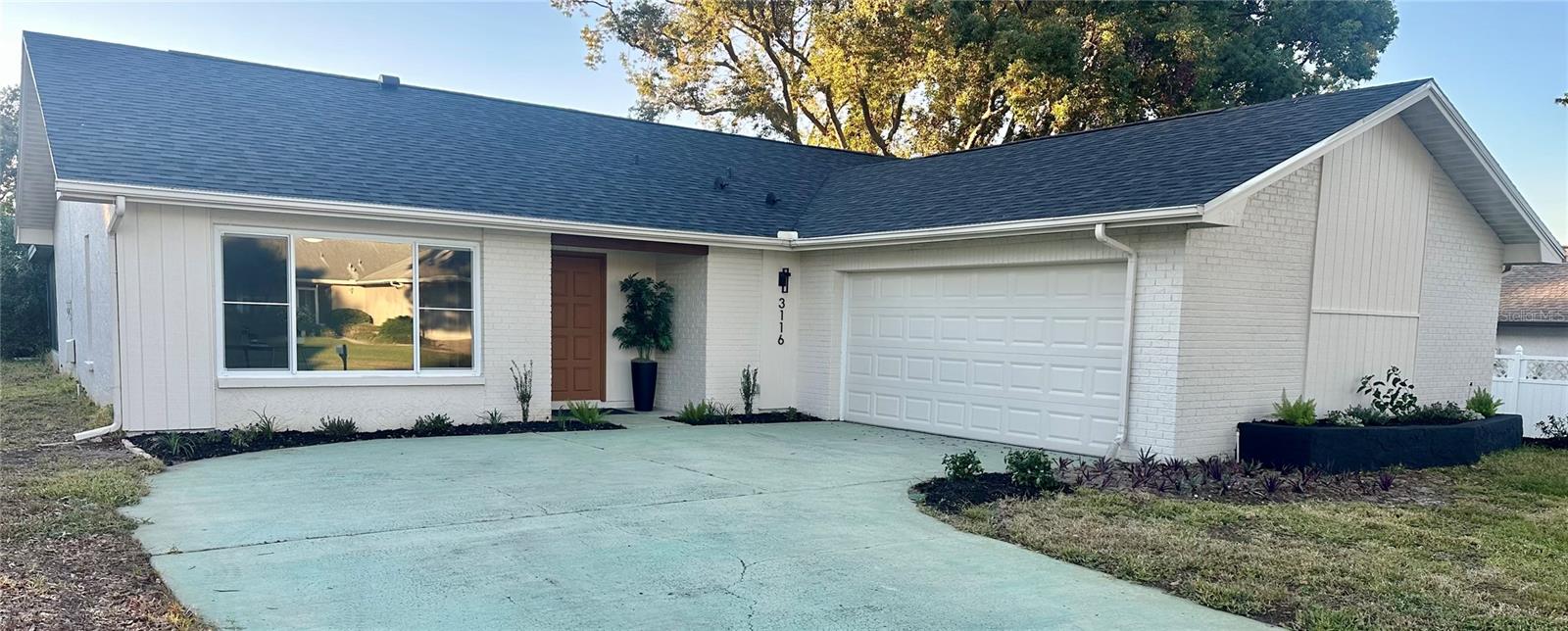 Welcome to Florida with this beautifully remodeled home that offers nearly 1700 square feet of stunning living space. This home was thoughtfully reimagined with Florida living in mind. The Springfield plan features front living with a new flex space that can be a third bedroom, den, office, game room, or whatever suits your needs. The open concept kitchen offers a wide quartz counter/bar adjacent to a cozy family room, dining and sitting area for all family gatherings...an entertainers dream. Brand new appliances and an envious walk-in pantry to store all large appliances, food and household supplies. Sliding doors lead to a screened lanai...true indoor/outdoor living at it's best. The backyard has space for more patio & the possibility of privacy landscaping an opportunity to create your own outdoor oasis. The spacious primary suite has been remodeled with dual sink vanity, a walk-in closet plus a dressing area with room for a second closet. There is a third bedroom next to a gorgeous second bathroom. A coveted inside laundry room has a utility sink and access to the garage. There is generous closet space and the garage is large enough for two cars and a golf cart. This property is WORRY FREE  with new hurricane impact windows, new roof 2025, air conditioner 2023, and hot water heater 2018. Brunswick Circle is one of the nicest streets in the highly sought after Highland Lakes community. Highland Lakes is Palm Harbor's premier 55+ golf and lakefront community. It boasts a friendly country club atmosphere with well maintained grounds & facilities. The HOA fee of just $164 a month includes free golf on 3 private executive courses, tennis, pickleball, bocce, and shuffleboard courts, a huge heated pool and spa, a large clubhouse with a busy schedule of performing arts and social events, exercise classes, a lodge on Lake Tarpon with a private boat ramp, fishing pier, community pontoon boats, and 2nd heated pool, and free RV or boat storage in a secure lot. Highland Lakes is a golf cart community, eliminating the need for two mid-sized cars for many couples and there's room in the garage for a golf cart too. Highland Lakes is blissfully close to Gulf beaches, a wealth of stores and restaurants, excellent medical services, exciting pro sports, rich cultural resources, 2 international airports, and a cruise port. With an unusually high elevation, it is above the flood plain and is even a non-evacuation zone. Your best Florida life is ready and waiting for you right here in this beautiful MOVE IN READY home.