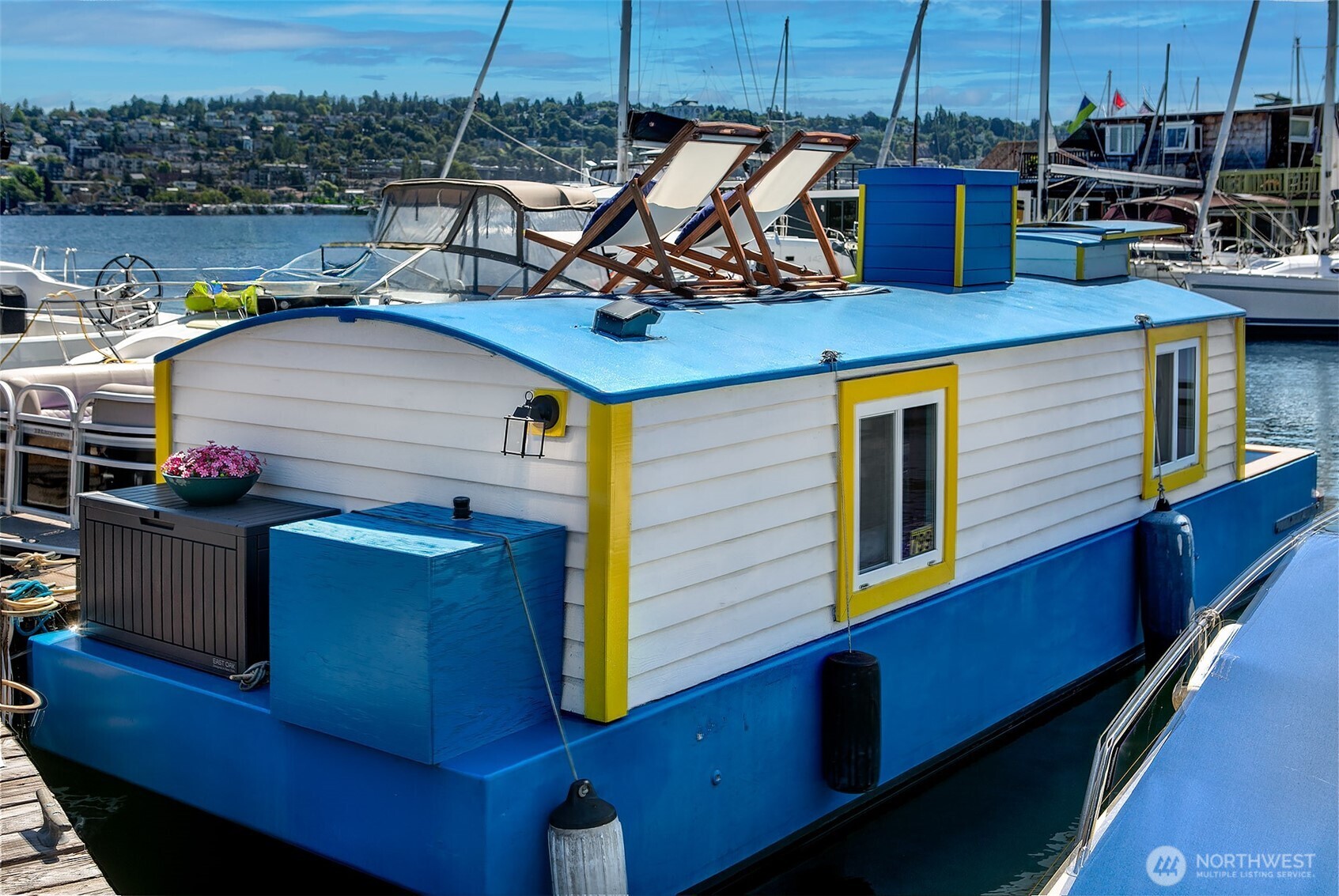 Afloat on Lake Union aboard the S.S. Guppy, begin mornings on the aft deck with coffee and the water’s gentle lap. Ahead, the skyline shimmers as a storied floating home community crowned by the famed Sleepless in Seattle sets the stage for your next story. Crafted to last by master boatbuilder Brad Rice: Meranti Hydrotek hull, arched ceiling, hardwood sole. Moored in its friendly, gated marina for 25 years, S.S. Guppy offers rare solace minutes from the SLU tech hub. Paddle to Gas Works Park or cycle the Cheshiahud Loop. Evenings bring painted skies, drifting water & the quiet sway that trades square footage for soul. Zone 25 parking. Slip $585/mo + $500 fulltime liveaboard.