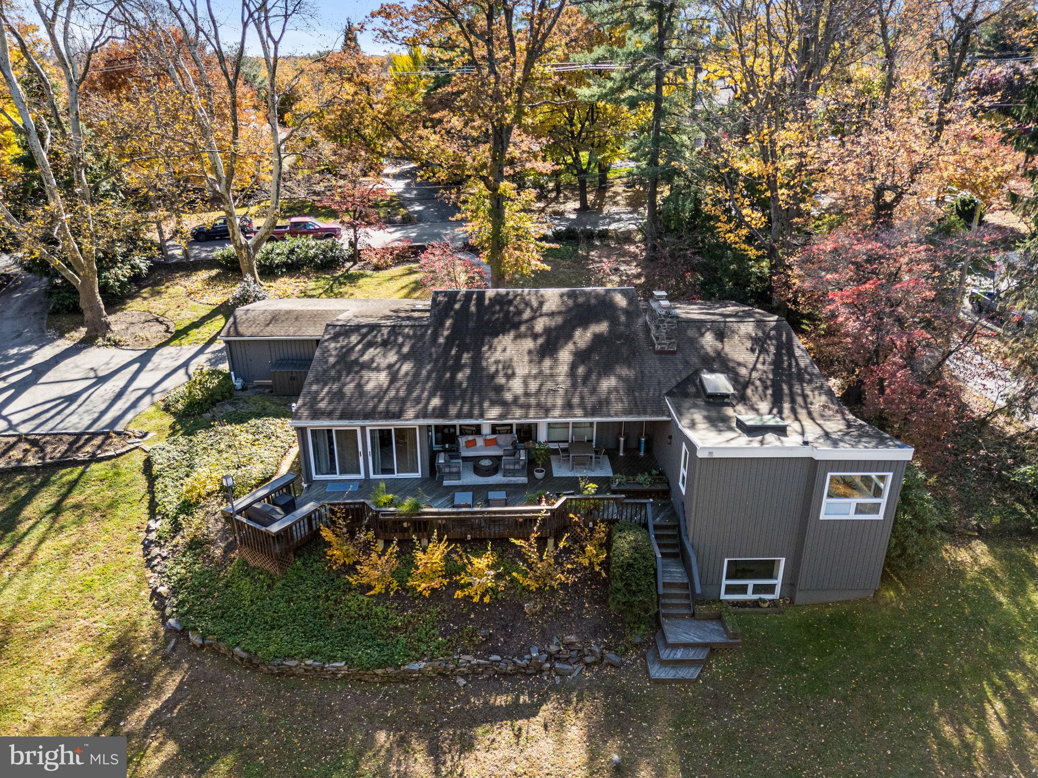 Deadline for Presentation of Offers is March 15, 2026 at 1:00.  Please see attached document for presentation of offers instructions. Thank you! Welcome to 1424 Flat Rock Road. A remarkable opportunity to own a striking Mid-Century modern residence designed by noted architect Vincent Kling. This 3,298 sq foot residence, featuring 4 bedrooms and 3 full bathrooms and sitting on .89 acres, is the epitome of mid-century architecture.  Surrounded by mature trees and filled with natural light, this thoughtfully updated home showcases timeless  design paired with meaningful improvements. Extraordinary vaulted ceilings, exposed wood beams, skylights, and walls of oversized window throughout the home, capture breathtaking views of the surrounding grounds from every room and creates an impressive and  inviting atmosphere. The open floor plan offers exceptional flow for both everyday living and entertaining, highlighted by an extensively redesigned kitchen and great room.The spacious eat-in kitchen features premium Bosch appliances, including double ovens and a wine refrigerator, abundant custom walnut cabinetry, and a large island with seating for three. The kitchen opens seamlessly to a dramatic great room centered around a wood-burning fireplace with marble surround, walnut built-ins and an abundance of windows overlooking the inviting deck and the landscaped property. The sizable dining room, which seats 10-12, is an option for more formal dining. The main  level also features a private office/sunroom, 3 full bedrooms and 2 full bathrooms. The primary suite nestled down a corridor provides privacy  and includes a spacious bathroom and ample closets. Two additional bedrooms and a full bath complete this main living level.The lower level of the home adds exceptional versatility with a fourth bedroom and full bath, laundry area, and a substantial bonus room ideal for a gym, media room, playroom, office, or additional gathering space. Windows on this level provide valuable natural light.Notable improvements include: Roof replaced in 2018, Kitchen/great room renovation and flooring 2019,New HVAC system 2025, New Water heater 2026.Set on beautifully landscaped grounds just minutes from Center City Philadelphia, schools, shopping, dining, and train access, this architectural residence offers distinctive design, generous space, and an ideal setting for modern living.