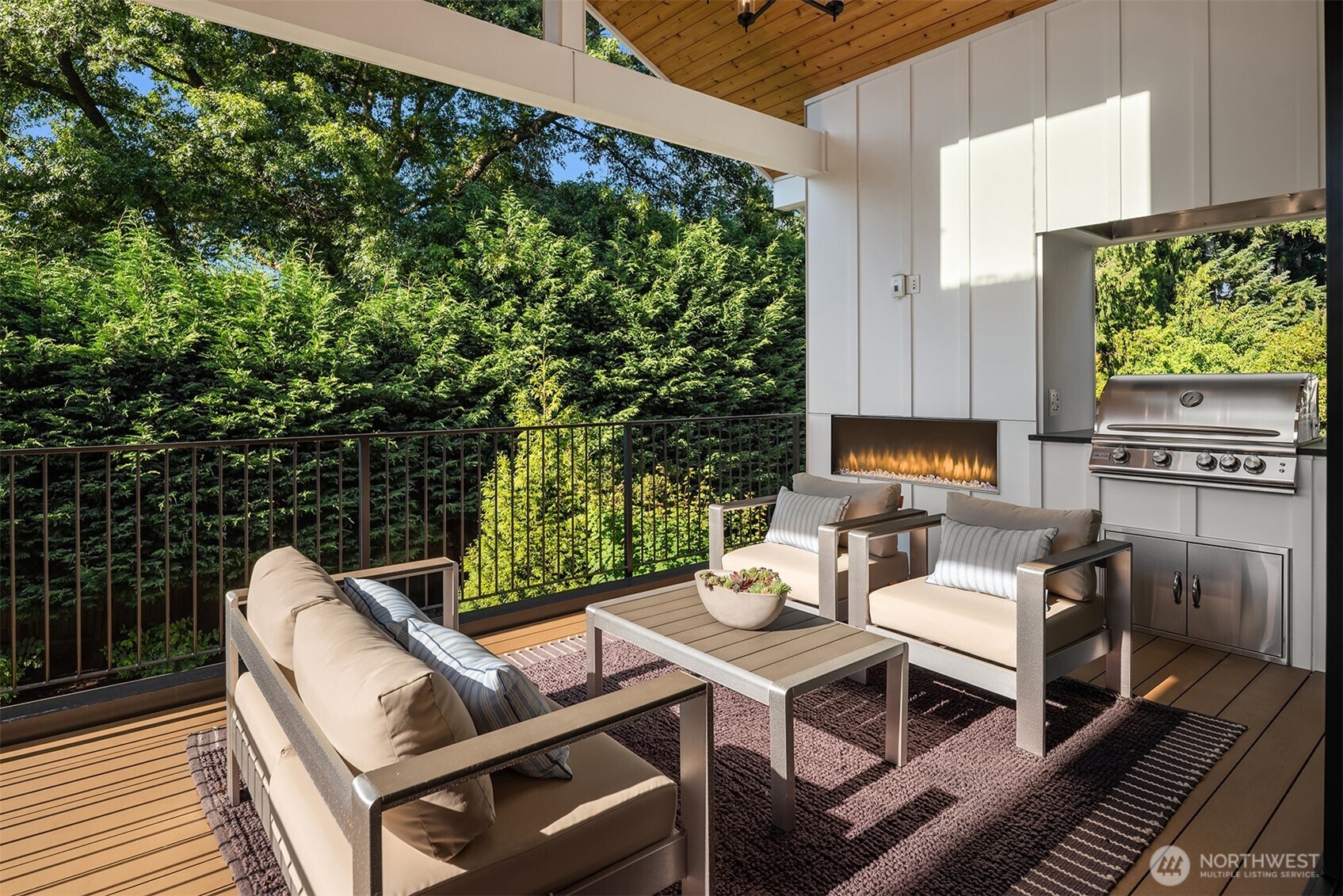 Covered outdoor living room with fireplace