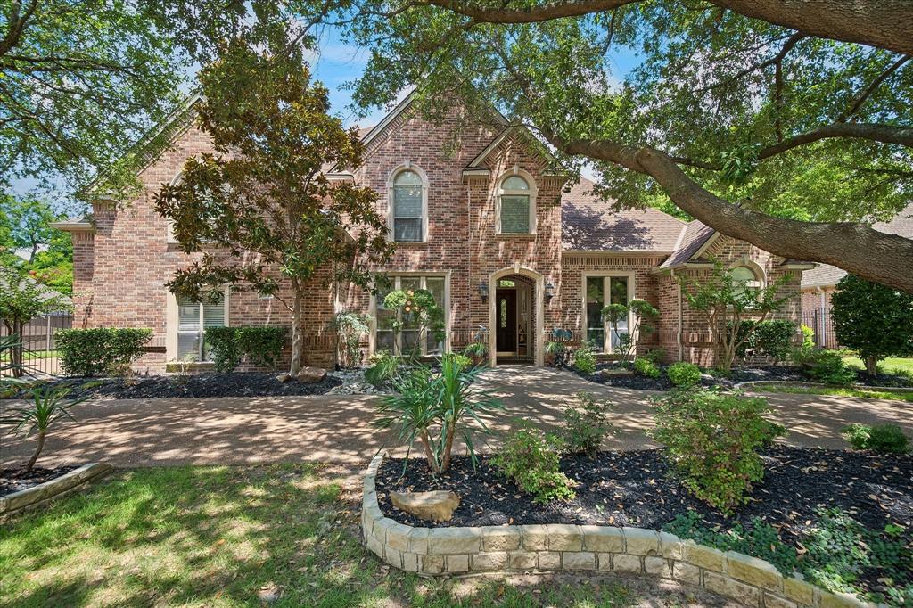 Experience refined luxury in the highly sought-after Timarron Cascades of Colleyville. This beautifully renovated 5-bedroom, 4-bath home offers 4,651 square feet of thoughtfully designed living space on a .40-acre homesite featuring a sparkling pool with waterfall and fountain, spacious backyard, and mature landscaping. The dramatic formal living room welcomes you with soaring ceilings, a custom staircase, and floor-to-ceiling windows that flood the home with natural light while showcasing picturesque views of the backyard oasis. Designed for everyday living and effortless entertaining, the home features three spacious living areas, three fireplaces, a private executive office, and a three-car garage. A first-floor secondary bedroom with an adjacent full bath offers ideal accommodations for guests or multigenerational living. The chef’s kitchen is the heart of the home, showcasing two oversized islands with leathered granite and honed quartz countertops, custom soft-close cabinetry, double ovens, a built-in Monogram refrigerator, a five-burner gas cooktop, and abundant prep and entertaining space. The luxurious primary suite features oversized windows, vaulted ceilings, and a spa-inspired bath with a freestanding soaking tub, separate walk-in shower, dual vanities, and an expansive custom walk-in closet. Upstairs you’ll find a generous third living area, two additional bedrooms with walk-in closets, including one with a private ensuite bath, plus an enormous fifth bedroom ideal as a media room, game room, fitness studio, or flex space. Residents enjoy a peaceful setting with a scenic lake, walking and biking trails, and beautifully maintained green spaces, all just minutes from premier shopping, dining, and entertainment. Conveniently located less than 15 minutes from DFW Airport with easy access to both Dallas and Fort Worth. Served by award-winning Grapevine-Colleyville ISD, this exceptional home blends timeless elegance, modern luxury, and an unbeatable location.