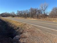 Beautiful piece of land located in Oklahoma County! This 26.60 acres provides great access to OKC, Mustang, and Will Rogers World Airport. If you're looking for acreage for a housing development or space to build your own home that's close to all the amenities, take a look at this one! Great paved road and frontage Utilities at road . Sewer system is on the property. Makes for good farming or to build