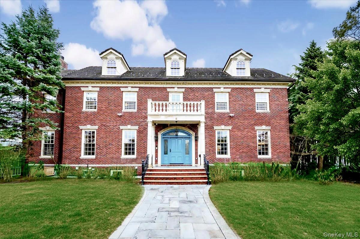 Located in the historic neighborhood of Douglaston Manor, this exceptional 5-bedroom/3.5 bathroom Center Hall Colonial offers over 5,500 sq. ft. of refined living space. Custom built 25 years ago by the original and only owner, this residence sits on two expansive lots totaling over 12,000 sq. ft. and is ideally positioned as the second home from the water. The exterior features include brick, slate roof, a Romeo and Juliet balcony with water views, radiant-heated driveway and walkway, in-ground sprinklers and a security system to name a few. The home’s interior boasts a thoughtful layout and superior craftsmanship. Highlights include radiant heat flooring, central vacuum, CAC and heat, custom doors and mouldings, architectural ceilings/skylights, gas fireplace, generator, a video security system and more. The bathrooms and EIK have been recently remodeled. Ideally located just a 1/4 mile from the LIRR and down the block from The Douglaston Club, residents can enjoy swimming at the pool, playing tennis and dining with friends-further enhancing the exceptional lifestyle this home offers.