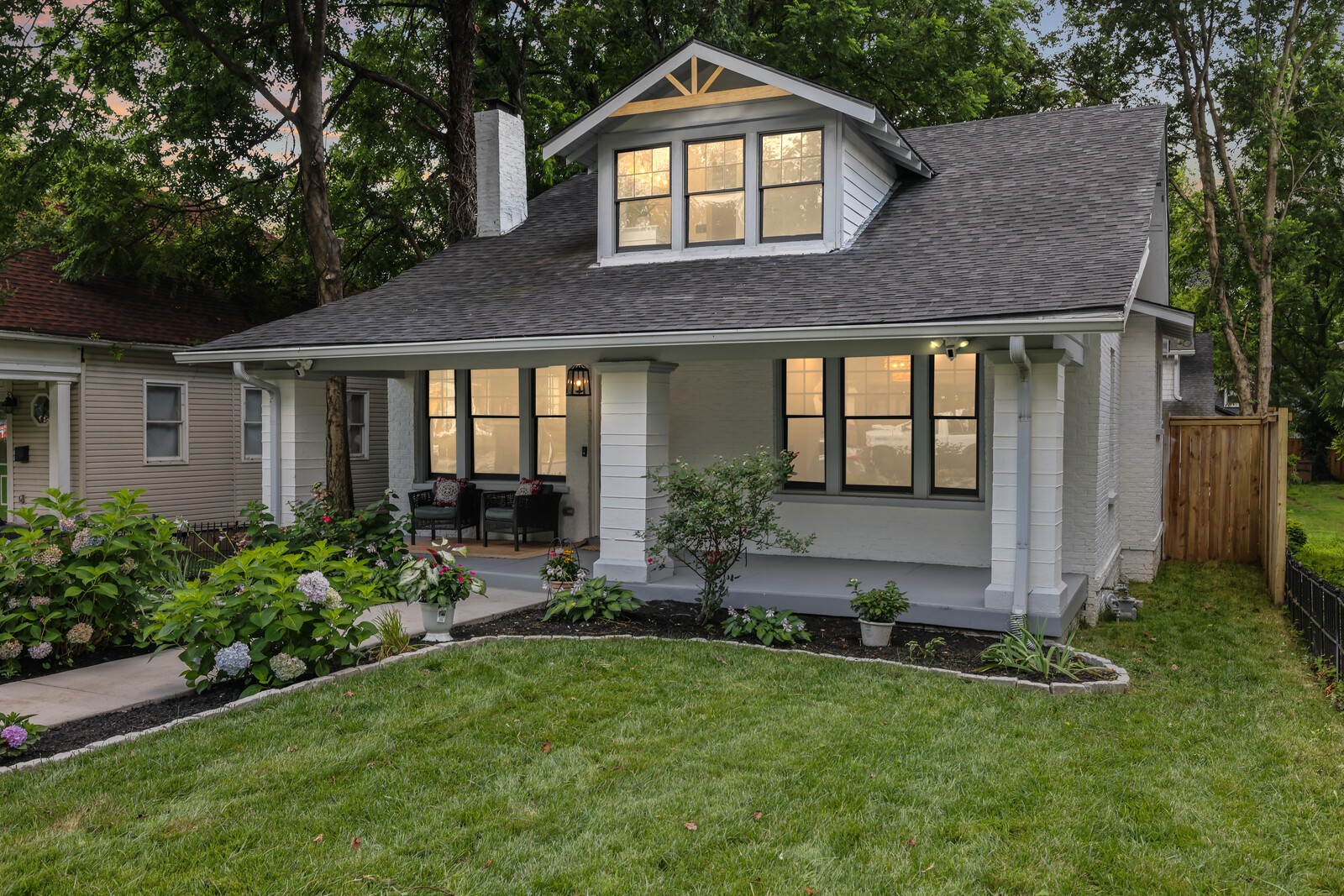 Discover a rare opportunity in the heart of East Nashville with this beautifully renovated historic home, offering both timeless charm and modern functionality. The main house spans 2,402 square feet and features 4 bedrooms and 3.5 bathrooms, thoughtfully updated while preserving original details and character, including the hardwood floors, fireplace, and blend of original and new windows. Step into the light-filled kitchen where quartz countertops, marble surfaces, Wi-Fi-enabled smart appliances, pull-out cabinetry, and an oversized pantry come together to create a chef’s dream. The primary suite offers a peaceful retreat with dual vanities, a soaking tub, a large walk-in shower, and deep closets. Additional highlights include a dedicated office/flex space, two HVAC units, a 2.5-year-old asphalt roof, and fresh landscaping with low-maintenance artificial turf. A major bonus is the detached accessory dwelling unit. This 964 square foot space features 2 bedrooms, 1 bathroom, a full kitchen, double vanity, stylish finishes including granite countertops, white cabinetry, and unique accent wallpaper. It also includes a washer and dryer, a one-car garage with storage, and freshly painted interiors. Perfect for rental income, guests, or multigenerational living. Outside, enjoy a grill-ready patio and low-maintenance turf backyard, with alley access to a garage and three additional parking spots. The yard and patio can be designated for the main residence or for renters/guests, and the property is eligible for owner-occupied short-term rental (OO STR). This exceptional East Nashville gem offers the best of city living, smart investment potential, and historic character in one outstanding package. Up to 1% lender credit on the loan amount when buyer uses Seller's Preferred Lender.