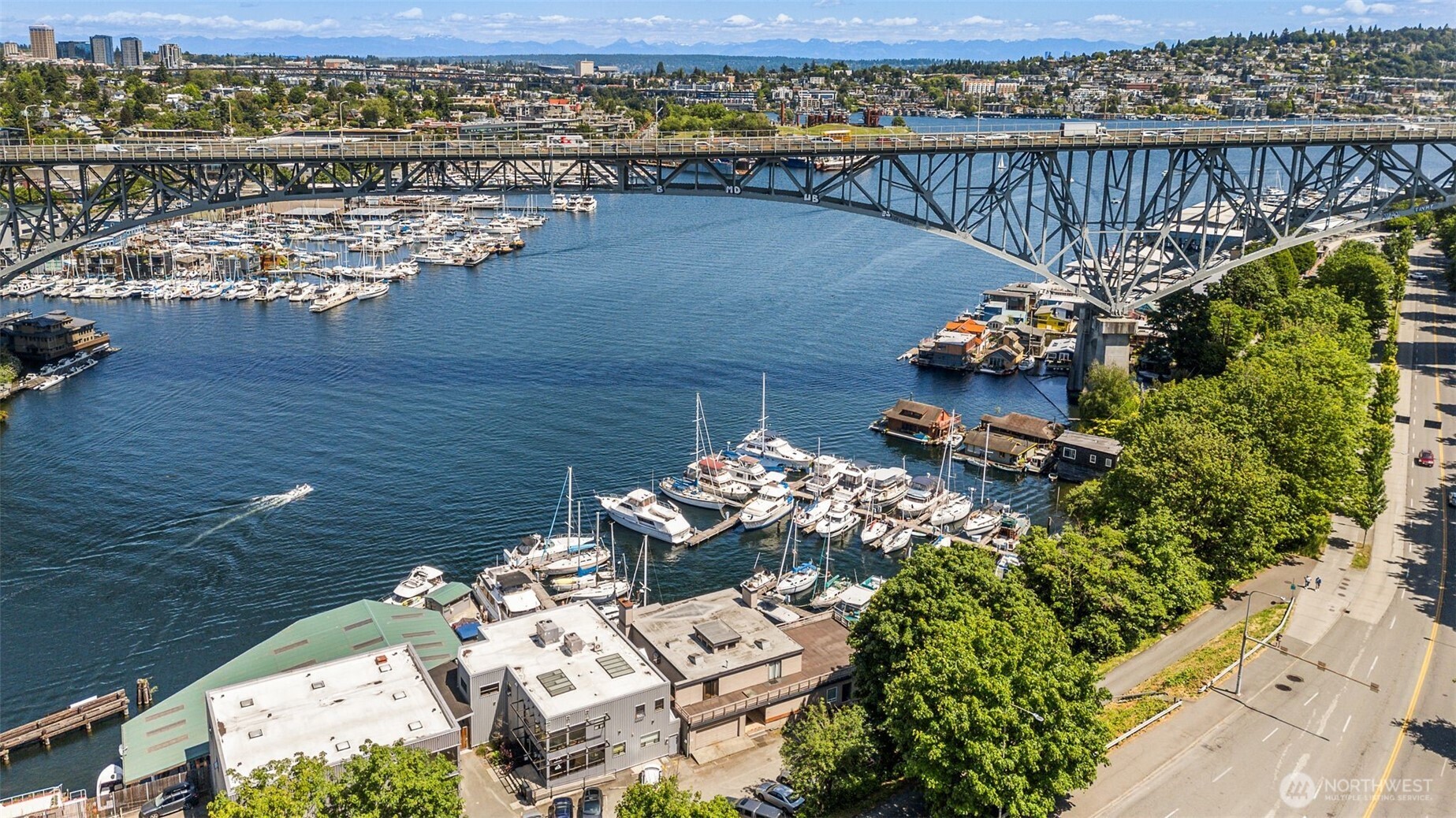 Welcome to Lee's Landing: Seattle's Premier Waterfront Legacy at the base of the Fremont Bridge in the heart of Lake Union - Discover an incredible waterfront oasis at this highly sought-after rare property with waterfront residence, offices, and marina. Expansive 3200+ sq ft home with a 2-car garage and ample parking is quintessential waterfront Seattle and has income producing commercial space and marina:  4200 sq ft of clean, rentable offices and secure marina facilities, including marina office, workshop, showers, and laundry. The 40-slip gated marina provides a pristine haven for vessels 25-55 ft, embodying a charming, practical hub amidst Seattle's vibrant boat parade. This is truly the pinnacle of Seattle waterfront living.