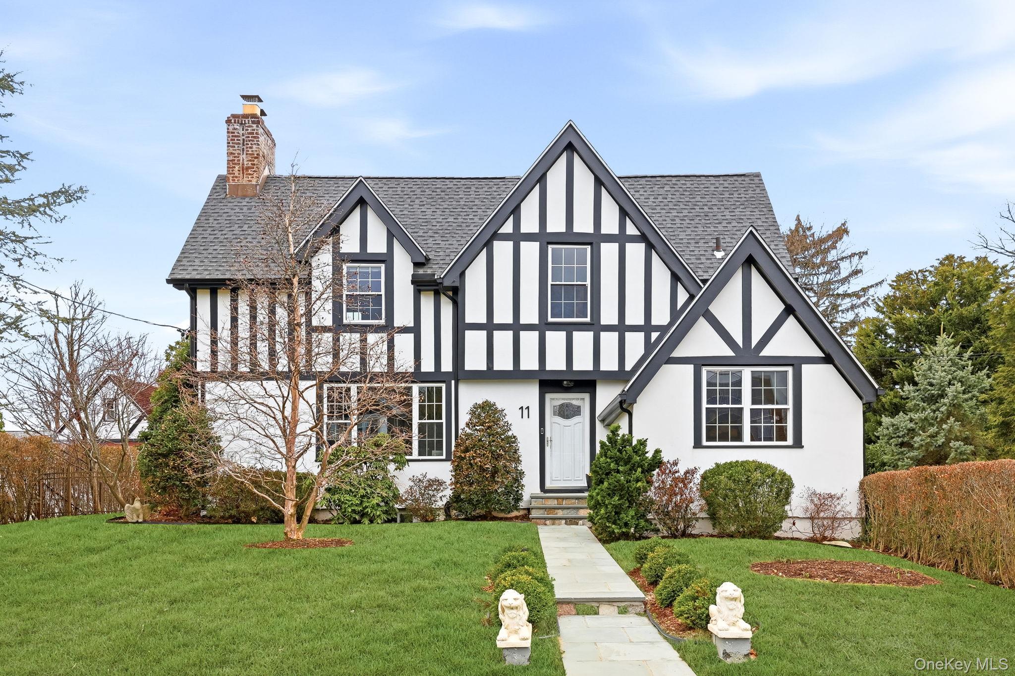 Beautifully positioned on its property, this stately Tudor reflects the elegance and craftsmanship of the pre-war era. Lovingly restored and meticulously maintained, the home blends classic character with thoughtful updates including gleaming hardwood floors, new windows, and an upgraded kitchen.The gracious interior features a dramatic living room with fireplace, formal dining room, charming den/media room, and powder room. A screened porch and patio overlook the flat, lush, fenced backyard—perfect for entertaining or quiet outdoor living.Upstairs are two well-proportioned bedrooms, a primary bedroom with access to a private rooftop terrace, and a full hall bath. The unfinished basement offers ample storage or flexible workspace, and a sauna is included in the sale. A truly distinctive offering. Welcome home!