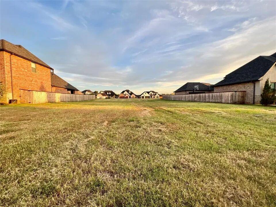 Location. Location. Location. This is a beautiful lot in one of the nicest neighborhoods in Norman. The realtor is a builder who owns Swan Hollow LLC. The company has been building in Norman for over forty-eight years.The lot sits flat and has fences on two sides.