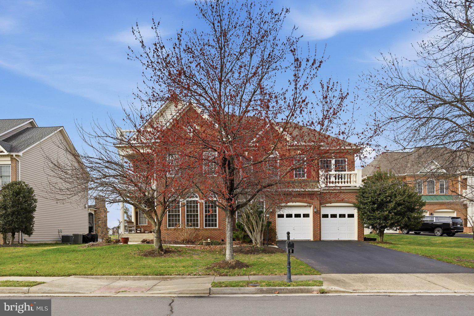 Welcome to 41869 Feldspar Place, beautifully situated on a private premium cul-de-sac lot backing to the mature trees of Byrne Ridge Park. From the moment you enter, the light-filled main level welcomes you with beautiful wood floors and a dramatic two-story foyer. A dedicated dining room offers the perfect space for hosting gatherings and special occasions. A main level bedroom suite with a full bath and large closet provides wonderful flexibility for guests or multigenerational living. The spacious family room with a cozy fireplace is the perfect place to relax, while the private office creates a stylish and quiet work from home retreat. At the heart of the home is a beautiful gourmet kitchen featuring a walk-in pantry, gas cooktop, stainless steel appliances, wall oven, and refrigerator with ice maker. Upstairs, the primary suite offers a large sitting room, two walk-in closets, a covered balcony, and a modern bath with a soaking tub, separate walk-in shower with bench, dual vanities, and a dedicated makeup area. Two additional bedrooms feature walk in closets and share a Jack and Jill bath, while the fourth bedroom includes its own private en suite bath. The outdoor spaces are just as impressive, with a charming covered front porch, rear deck, and extensive hardscaped patio overlooking the private, tree-lined setting. The lower level adds even more versatility with extra space for hobbies, storage, and a walk-up exit. Conveniently located near top-rated schools, premier shopping and dining, and commuter routes, this home delivers the ideal balance of privacy, comfort, and accessibility. Photos may be virtually staged