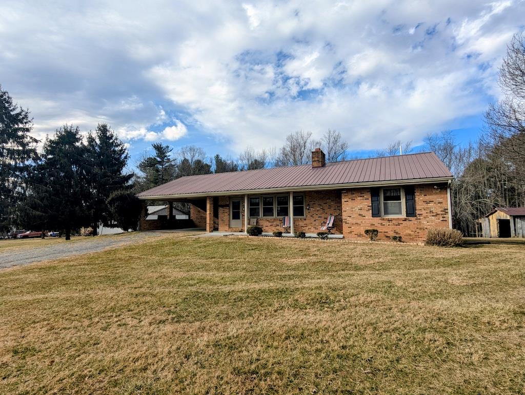 Brick ranch with 7.97 acres less than five minutes from the Town of Floyd VA! It's becoming a rare find to locate both a home and acreage close to town. Built in 1980 this solid brick ranch home showcases a modern kitchen, ample dining and living room space with 3 BDR, 2.5BTH. Having the laundry, bedrooms and 1.5 baths on the main level this home works well for any stage of life. An unfinished basement complete with a cellar for your canned goods provides extra storage capacity. Additionally several outbuildings compliment this property. The driveway is level and easy to access with open pasture in front of the home ready for your livestock!! Fiber internet available!!