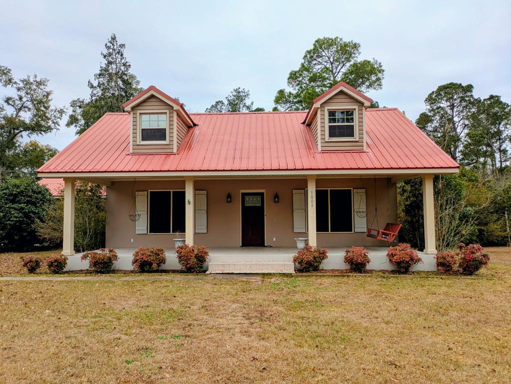 Discover this beautifully maintained home for sale in Quitman, GA, offering high-speed internet, timeless Southern charm, and nearly 1.5 acres of private land on a quiet cul-de-sac lot. This spacious property features a welcoming rocking-chair front porch, hardwood floors throughout most of the home, and an expansive back deck with covered porch ideal for year-round entertaining and grilling. Inside, enjoy a large living room with fireplace, an additional family room, and a fully remodeled chef's kitchen with a generous breakfast area and premium appliances, including a Jenn-Air double oven, Jenn-Air 5-burner gas cooktop, and Whirlpool refrigerator. The home also includes a large laundry room and a versatile bonus room perfect for a home office, playroom, or potential 6th bedroom. With 5 bedrooms, 2 bathrooms, a fenced backyard, 2-car covered carport, and 1-car garage, this Quitman, GA home delivers the perfect blend of space, privacy, and modern convenience, ideal for buyers seeking peaceful country living with today's amenities.