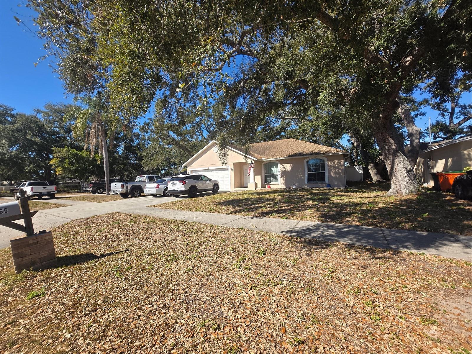 This large 3-bedroom 2 bath single family home with cathedral ceilings is centrally located in a non-evacuation zone and has many energy saving and environmentally aware features and hurricane shutters. This open split plan has large living areas and bedrooms.  Primary bedroom has a walk-in closet and its own bathroom.  Laundry room is located inside the home. The energy saving features are Low-e Energy Efficient windows, Energy Star 14 SEER Heat pump, Energy Star Programmable Thermostat, Energy Star ceiling fans, Energy Star Dishwasher, Eco-care low VOC paints and low flow faucets and commodes. The fully fenced back yard with new vinyl fence offers a lot of room for entertaining and play time.
