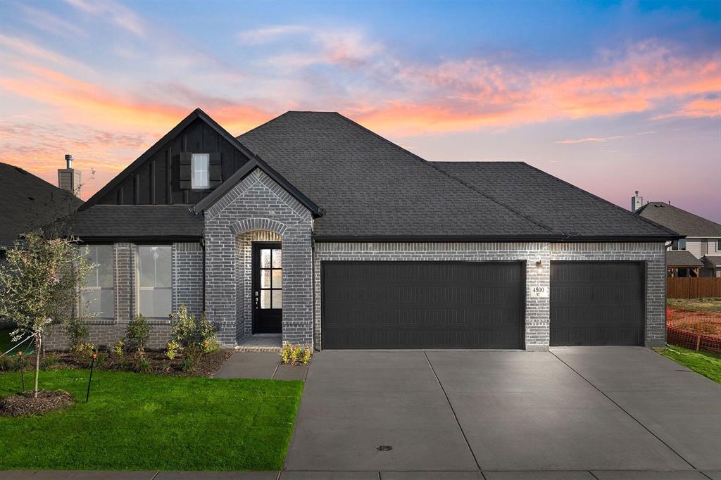 MLS# 21078467 - Built by Coventry Homes - Const. Completed Sep 28 2025 ~ From the moment you arrive, this home makes a statement. With its striking modern elevation and undeniable curb appeal, this 4-bedroom, 3-bath gem offers over 2,300 sqft of thoughtfully designed living space. Step inside and be greeted by warm, earthy tones and elegant luxury vinyl plank flooring that guides you through a bright and open floor plan. The heart of the home—the gourmet kitchen—features a show-stopping natural stone island, farmhouse sink, and seamless sightlines into the great room, making it ideal for both everyday living and entertaining. Step outside to a massive covered patio built for al fresco dining, weekend BBQs, or peaceful evenings under the stars. Sophisticated, spacious, and full of upgrades—this is more than a house, it’s your next dream home. Come see it today before it's gone!