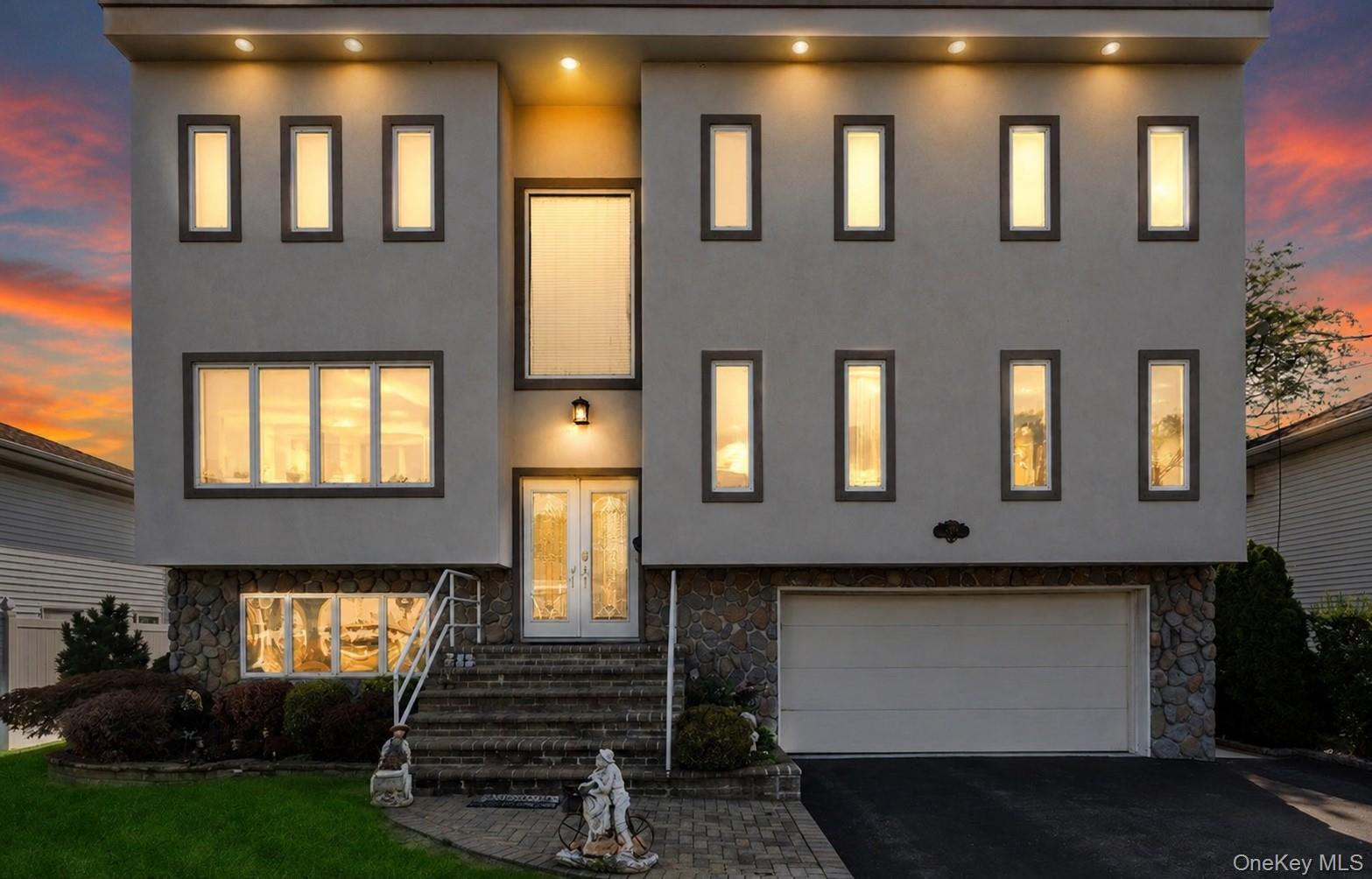 Located near Seaman's Creek and South Oyster Bay, this beautifully appointed 3-story home offers nearly 3,000 square feet of living space with modern inspired design throughout.The top-level features two bedrooms, including a spacious Primary Suite with a private ensuite bath, bathed in natural light from multiple skylights. The main level offers a living room, dining room, and an eat-in kitchen with heated floors and private balcony access, along with three additional bedrooms. The lower level includes a spacious family room and a full bath.Additional highlights include hardwood floors throughout, Sub-Zero appliances, marble countertops, radiant heating, two fireplaces, newly installed windows, and abundant storage spaceConveniently located minutes from schools, shopping, dining, entertainment, and Seamans Neck Park.