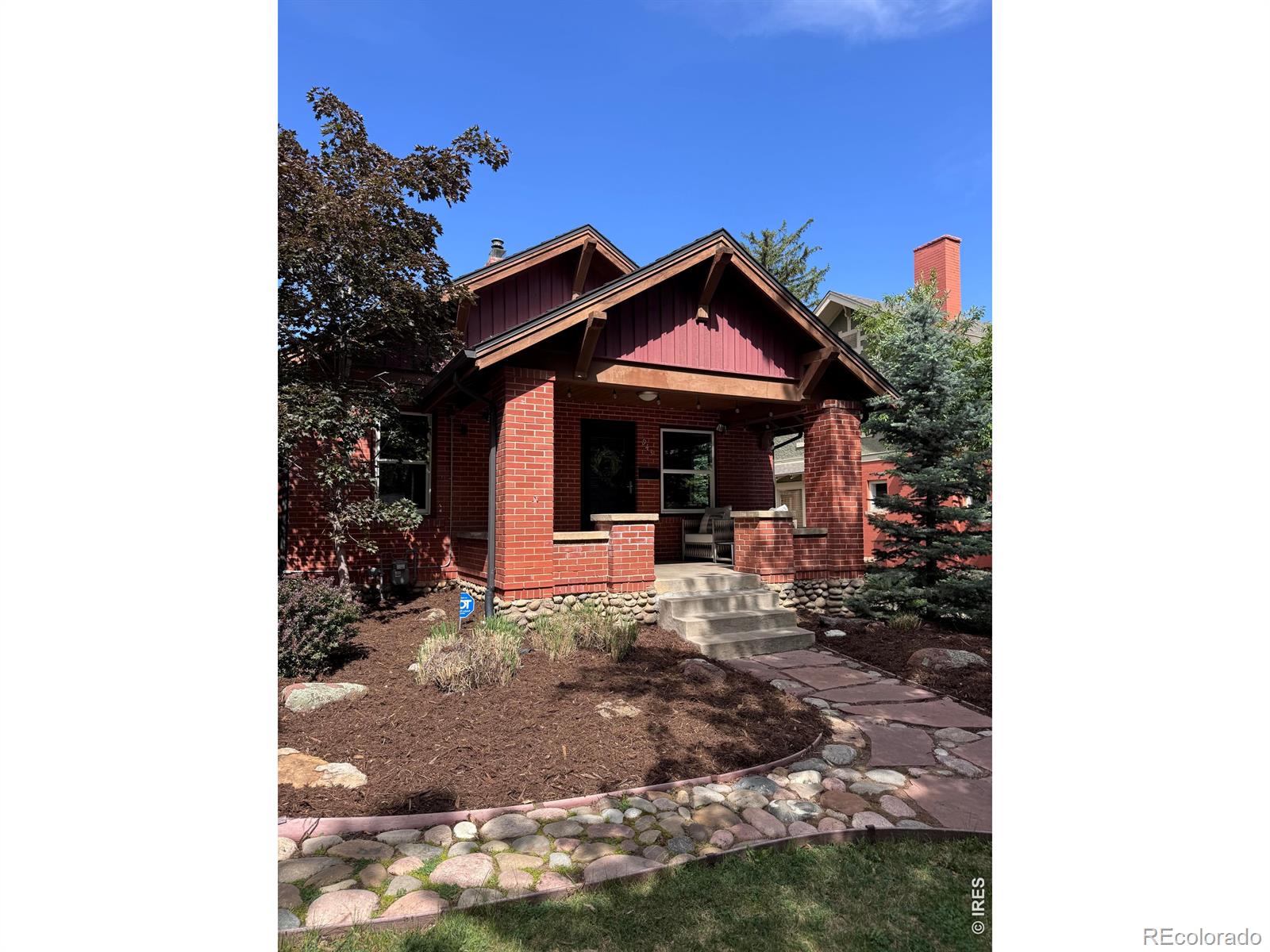 Welcome to life in the heart of Boulder! If you've ever dreamed of waking up just blocks from Chautauqua Park with the Flatirons as your daily backdrop, this is the one. Tucked into one of the most beloved streets on The Hill, this classic bungalow puts everything that makes Boulder special right outside your front door - endless hiking and running trails, restaurants, coffee shops, music, downtown Boulder - all within walking distance.The historic charm is real: step onto the classic bungalow porch and inside hardwood floors and big windows with original wood moldings, and built in shelving, give it that warm character that's hard to find. The main level has a smart layout - a primary bedroom with a large beautiful bath and walk-in closet, a dedicated office or bedroom, and an additional bedroom and bath, so the space truly works for how people live. The kitchen is the heart of it all - a stunning setup with a huge island, gas stove, tile-brick accents, and stainless appliances. Whether you're cooking for two or hosting a crowd, this kitchen delivers. Step down to the lower walk-out level and you'll find a 4th larger bedroom perfect for guests or a rec room, an updated 3rd bathroom, and a dedicated laundry room. Out back is where summer comes alive. The fully fenced, landscaped yard is made for morning coffee, backyard dinners, and those long Colorado evenings with a cathedral seating patio that's an entertainer's dream. And the oversized 2-car garage? A rare find in this part of town with plenty of room for all the outdoor gear that comes with the Colorado lifestyle. Classic bones, thoughtful updates, unbeatable location. Homes like this on The Hill don't come around often!