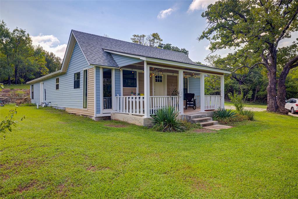 NATURE, SPACE, & MODERN COMFORT | 3BR/2BA | TWO ACRES NEAR LAKE THUNDERBIRD | Welcome to your private retreat near the Lake.  This 3 bedroom, 2 bathroom home sits on two wooded acres with tall trees, visiting wildlife, and stunning Oklahoma sunsets- 1512 sq. ft. with and open floor plan and windows designed to bring the landscape inside, nature becomes part of the living space.  This home has been thoughtfully and extensively renovated throughout.  The great room makes and immediate impression with vaulted ceilings and skylights that flood the space with natural light.  Fresh interior paint, new vinyl plank flooring in the living and dining areas, and new carpet in two bedrooms set a clean, move-in-ready tone.  Both baths have been fully renovated- featuring modern vanities custom tile showers and modern finishes that feel intentional, not builder grade.  Stylish new interior and exterior doors and partial guttering complete the package.  Step outside onto a spacious covered patio overlooking natural stone terraces with integrated French drains and excellent Southern exposure-engineered for Oklahoma weather, not just curb appeal.  The curated pollinator garden supports the monarch butterfly migration and attracts hummingbirds season after season.  Deer and wild turkey make regular appearances across the two wooded acres.  OEC fiber optic internet keeps you connected, with easy commute to Norman, Ok.  Lake Thunderbird's public boat ramp is under a mile from your door.  Kayaks, fishing rods, and paddleboards all have a home here.