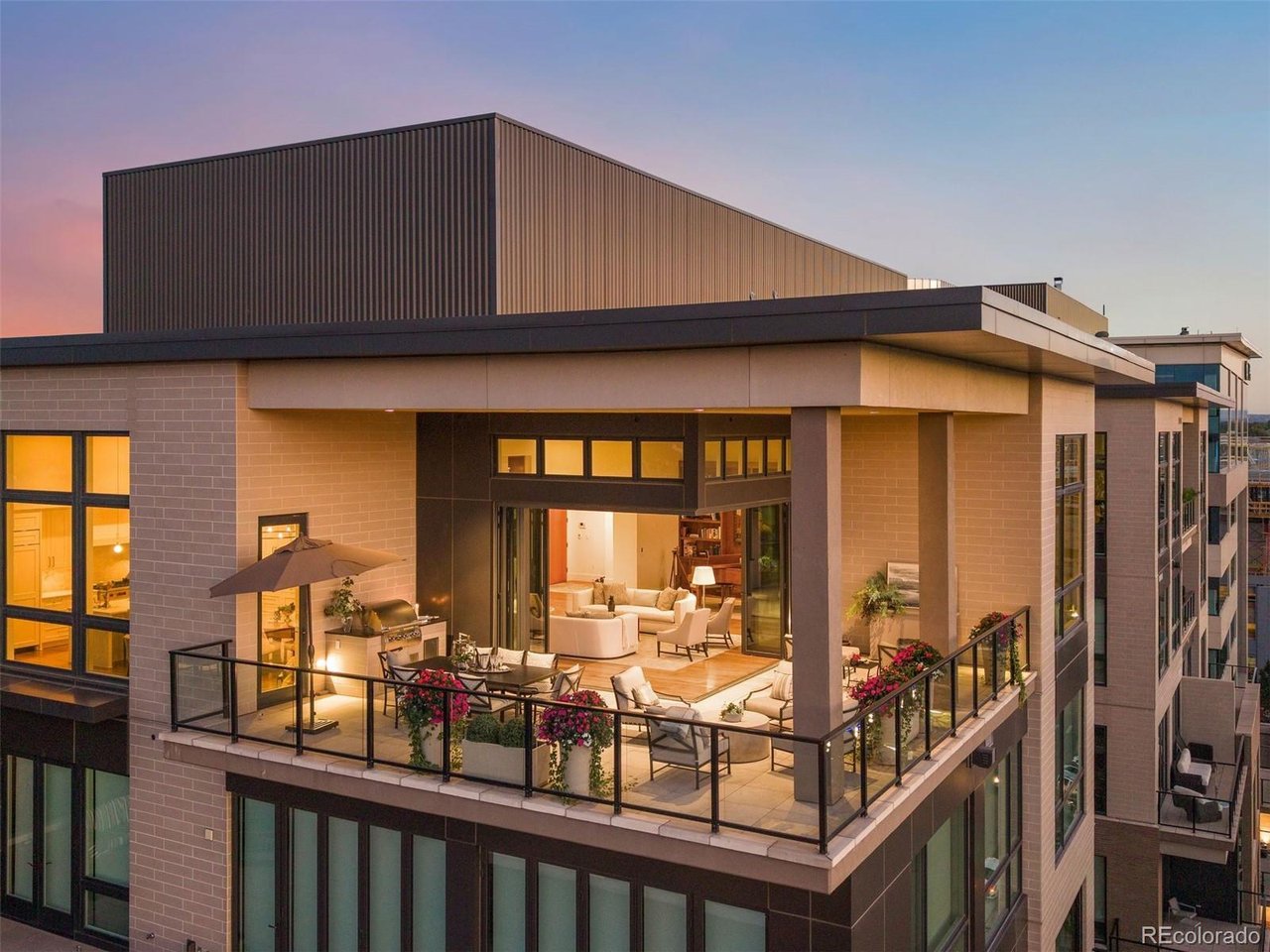 Set atop 250 Columbine, this extraordinary northwest corner penthouse commands sweeping views of the Front Range and downtown Denver. Spanning 4,627 square feet, the residence offers the scale and comfort of a private home with the ease of lock-and-leave living in the heart of Cherry Creek North. Soaring 12-foot ceilings and expansive walls of glass fill the interiors with natural light and frame the remarkable setting. A fully retractable corner NanaWall seamlessly opens the living spaces to one of Cherry Creek's largest private terraces. Designed for intimate gatherings and grand-scale entertaining, the expansive covered terrace features distinct living and dining areas, a separate lounge with concealed television, and an outdoor kitchen. The kitchen, living room, and dining room connect directly to this exceptional outdoor space, all enjoying unobstructed mountain views. The beautifully appointed kitchen pairs crisp white cabinetry and elegant stone surfaces with a generous island, walk-in pantry, and separate butler's pantry. A window-lined breakfast nook opens directly to the terrace, further embracing the residence's exceptional indoor-outdoor living. The primary suite is its own retreat, featuring a sitting room with fireplace and built-in shelving, a secluded balcony, and a spacious bath leading to an extraordinary 30' x 7' walk-in closet. Two additional bedrooms offer balcony access, while a dedicated office provides a refined workspace. Four deeded parking spaces, secure building access, a fitness facility, plunge pool, and outdoor lounge further distinguish the lifestyle offered at 250 Columbine. Ideally positioned amid Cherry Creek North's acclaimed restaurants, boutiques, and galleries, this exceptional penthouse combines rare proportions, breathtaking mountain and city views, and an unparalleled connection to one of Denver's most desirable neighborhoods. A residence of this caliber, in a setting this extraordinary, represents a truly rare opportunity.