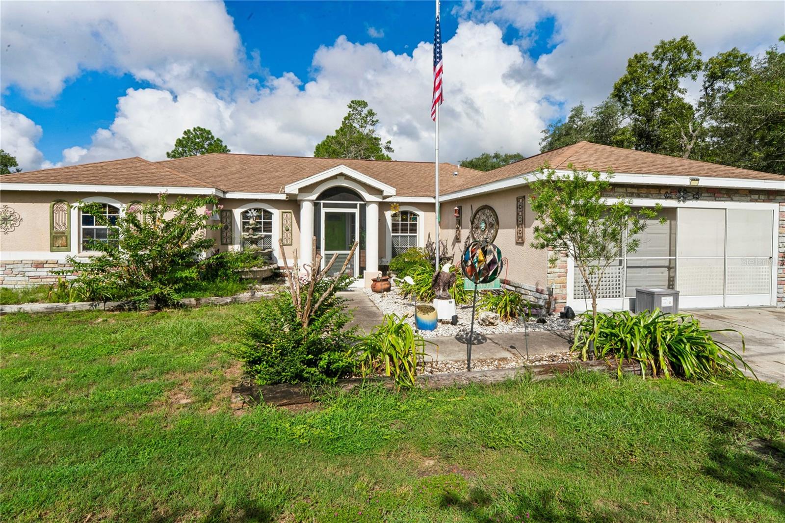 Charming Florida Home 3 Bedroom 2 Bath 2 Car Garage Florida Home an additional Detached Garage/building with workshop & another Separate Workshop /She Shed with electric on 1/2 acre. Welcome to this charming Florida home offering a unique blend of character, functionality, and outdoor space. From the inviting front to the expansive backyard, this property offers plenty of room to enjoy Florida living.The home features a welcoming covered entry, an attached two-car garage, and an attractive low-maintenance exterior accented with decorative stonework and established landscaping. Large windows bring natural light into the home, while the  landscaped front yard creates wonderful curb appeal.This thoughtfully designed 3-bedroom, 2-bathroom home features a classic split floor plan, open concept ,offering the ideal balance of open gathering space and a private primary retreat The primary has 2 walk- in closets, the primary bath with garden tub, water closet, and an oversized walk- in shower.  In the kitchen you will enjoy cooking on your gas range. A newer stainless steel refrigerator, dishwasher and farmhouse sink, has beautiful counters with plenty of storage space . The two bedrooms are of great size with double closets. The guest bath has tub and shower and a beatiful countertop  Whether you are a hobbyist, a car enthusiast, or simply seeking room to grow, this property delivers unparalleled versatility. In addition to the attached 2-car garage, the property features a detached metal garage and workshop--ready for your biggest projects, tools, or recreational vehicles. Need a quiet escape? A completely separate outbuilding with electricity provides the ultimate flex space, ready to be transformed into your personalized she-shed, man cave, home office, or creative studio. Enjoy the tranquil, country-like setting of Royal Highlands with no HOA restrictions, while remaining just minutes from Weeki Wachee Springs, the Gulf of Mexico, local shopping, dining, and the Suncoast Parkway for easy commute to Tampa or travel north to Crystal River to  enjoy all of what the nature coast has to offer.