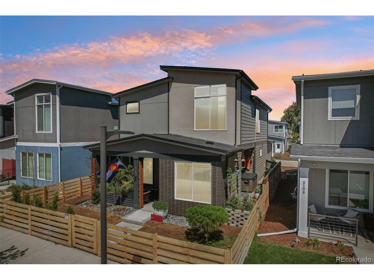 What if you didn't have to choose between the energy of Denver and coming home to your own private escape? Welcome to La Casa Bonita, created for someone who wants more than four walls. A place to live well, entertain often and genuinely love coming home.Just 10 minutes from RiNo, LoHi and Downtown, this former model home offers the style, space and outdoor living you'd expect at a much higher price point. The current owner took an already upgraded home and made it unforgettable.Inside, art, thoughtful design and custom finishes give the home warmth and personality. The chef's kitchen anchors the main level and was made for everything from morning coffee to a house full of friends.Upstairs are two spacious bedrooms and an oversized primary retreat with a spa-inspired bath featuring imported custom tile, dual shower heads and an enormous walk-in closet.Then step outside. Over $50,000 has been invested in landscaping and outdoor living. The fully fenced yard is a rare find in the community and features lush landscaping, flowers, a Campania fountain, string lights and a brand-new 7-person Seville hot tub.Imagine Friday night at home, drink in hand, watching the game from the hot tub on the 70-inch outdoor TV. Summer dinners under the lights. Dogs running in the yard. Friends gathered around the fountain. This is your own little piece of paradise in the city.Even the temperature-controlled garage offers flexibility for your vehicles, gym, studio or workspace.Available for purchase or as a fully furnished 1- or 2-year lease at $5,500/month with utilities included, offering a unique opportunity to experience La Casa Bonita before potentially making it your own.Some homes check the boxes. Others make you picture your life there. Come experience La Casa Bonita.