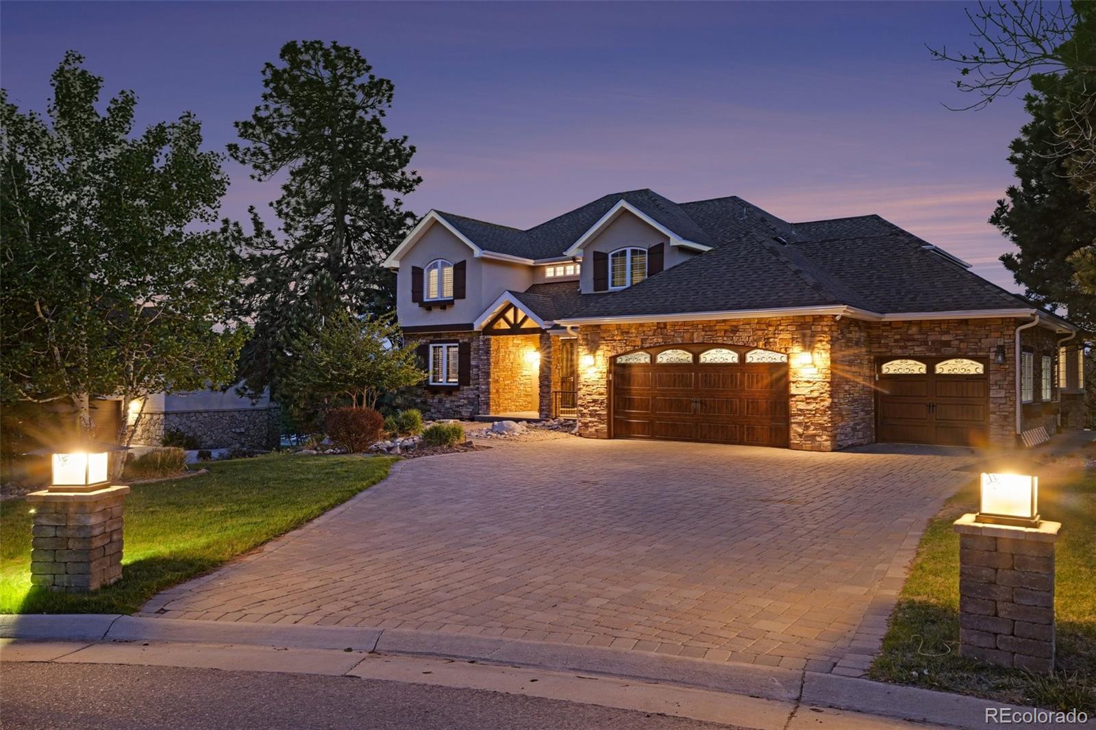 This extraordinary Parker home delivers an exceptional living experience across three beautifully designed levels. A dedicated office with built-in shelving and an elegant formal dining room set the tone upon entry, leading into a bright and spacious living room with soaring high ceilings and a brick fireplace. The modern kitchen impresses with a large island, gas range, breakfast nook, and bar seating, flowing seamlessly into the living and dining spaces. The primary suite is a true sanctuary featuring a modern fireplace, a private balcony, and an ensuite bath with dual sinks, a soaking tub, a walk-in shower, and a walk-in closet. Upstairs, a loft and three additional bedrooms round out the level, one with an ensuite bath and two sharing a jack-and-jill bath. The basement delivers a large rec room with a wet bar, an exercise room, a bonus room with covered patio access, an ensuite bedroom, and a large storage room. Outside, a spacious deck off the main level leads to a partially covered patio with an outdoor kitchen, all framed by breathtaking mountain views.Black+Haus Tavern, Wolf Peach Public House, and Ovest Via offer exceptional dining just minutes away. Parker's walkable Mainstreet adds boutique shopping and a wonderful community atmosphere right at your doorstep.Click the Virtual Tour link to view the 3D walkthrough. Discounted rate options and no lender fee future refinancing may be available for qualified buyers of this home.