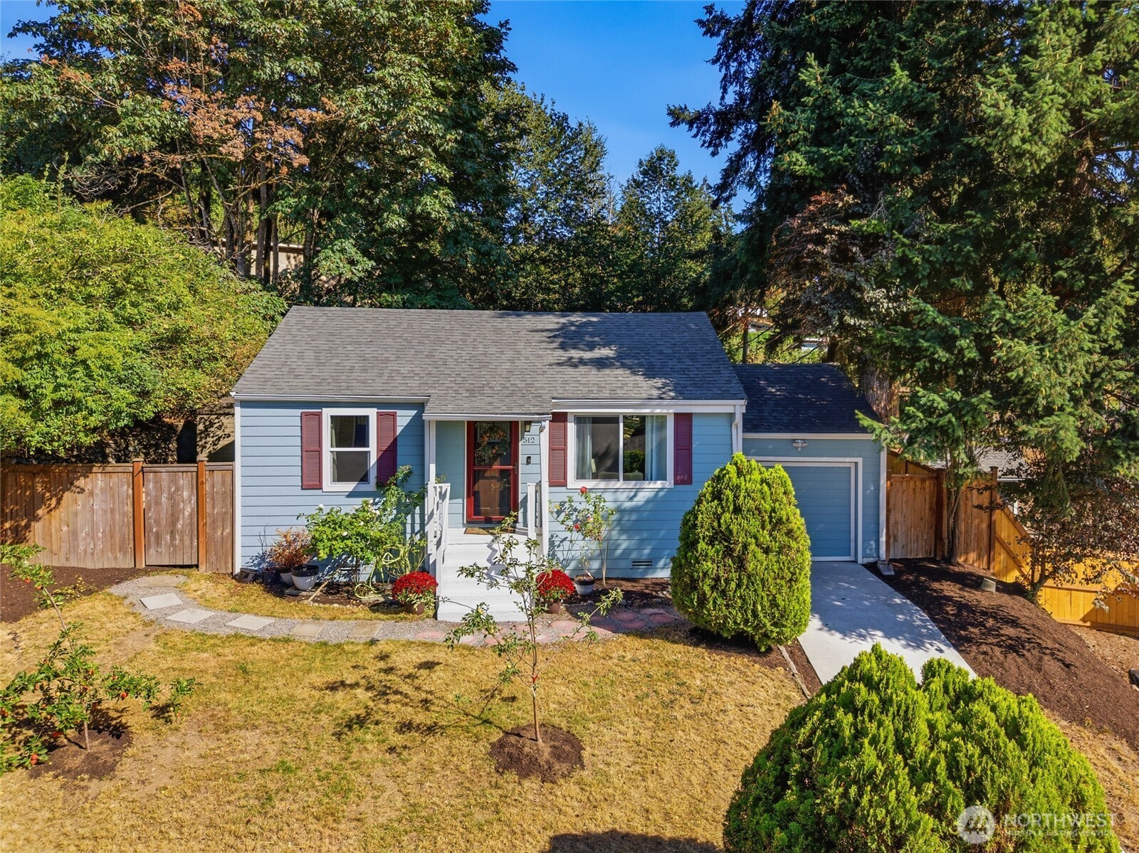Welcome to this charming 2-bedroom Windsor Hills rambler! Perched on a spacious lot with territorial views, this home offers thoughtful improvements throughout plus an incredible backyard retreat. Inside, large living room windows fill the space with natural light, while beautiful oak hardwoods run throughout much of the home. Two generously sized bedrooms, an updated full bathroom, and a refreshed kitchen with new stainless-steel appliances complete the inviting layout. A thoughtfully added laundry/utility room provides ample additional storage and functionality. Buyers will appreciate notable improvements including the siding & exterior paint, along with an updated plumbing and electrical panel for added peace of mind. Out back, the fully fenced yard has been completely transformed into a serene outdoor escape featuring a beautifully updated concrete patio, established garden beds growing potatoes, strawberries, beans, and more, a firepit area, plum trees, and plenty of space to relax, entertain, or continue gardening. Out front, mature apple trees and beautiful landscaping enhance the home’s curb appeal. The oversized attached 1-car garage offers even more storage plus a dedicated workbench area. Conveniently located near I-405, The Landing, Downtown Renton, SeaTac, Boeing, parks, shopping, dining, and more!