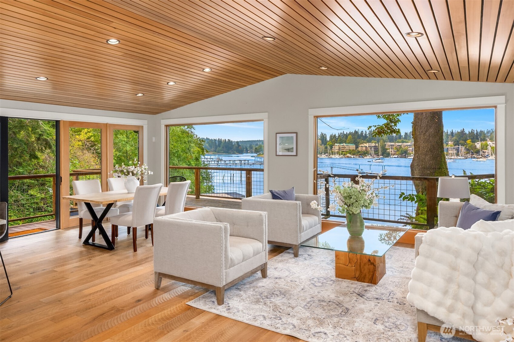 Eagle Harbor waterfront oasis with privacy galore. Low bank pier with floating dock you can stroll onto from your front door! A True deep water dock that can accommodate a 65+ft boat with a keel up to 20ft. Dock equipped w/water & marine grade electrical post for secure and easy boat moorage. Enjoy wild birds nesting, seals frolicking & otters gliding by from the home's deck. This experience feels like you're in the trees at the water’s edge. End of pier deck for cocktails & dinner parties entertained by the seals w/their babies & unparalleled 360 views of sunrises over Seattle & sunsets over the Olympic Mountains. Friends w/boats may use the 2 private registered moorage balls to join the pier party by boat, should the dock already be full. The turnkey home allows secure time away while cruising the waters of the PNW.  A Chef's kitchen with broad water views that makes any meal prep & cleanup feel serene. Rock terraces & mature gardens make yardwork minimal & avail more time for paddle boarding & kayaking off the dock. Entertainment can flow inside to outside w/roll-up glass doors, a large courtyard and rock terraces to host outdoor fires! This homes provides so many opportunities to feel the Pacific Northwest in all its grandeur. Privacy, views, boating, gardening, entertaining and the simple pleasures of watching wildlife in their habitat. A perfect place to call home!