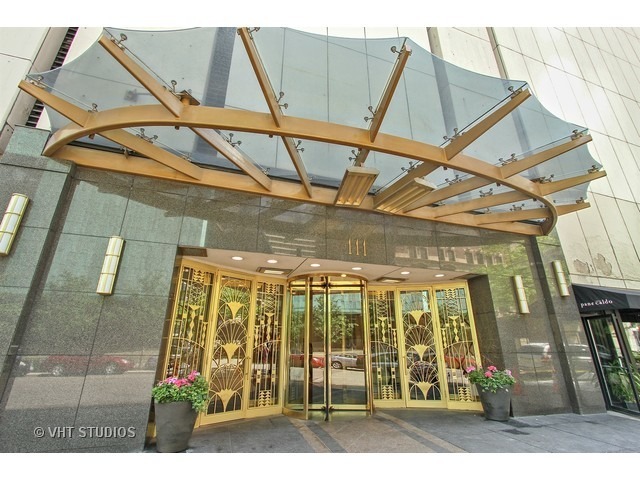Enjoy some of the best views in Chicago with floor to ceiling windows along with city living at its finest in the heart of the Gold Coast.  This highly desirable 'A' tier home overlooks Oak Street Beach and Navy Pier where you can enjoy the fireworks from your couch.  Updated kitchen with high end Subzero and Thermador appliances and a 2-tiered counter make for the perfect entertainment space.  Master bedroom has an en-suite bathroom with a spa like feel consisting of marble tile, a soaking tub and separate shower.  The second spacious bedroom has a built-in work station which makes it perfect for working from home.  Washer and dryer inside the condo.  Storage locker included.  The building has all the luxurious amenities including a pool, sun deck, exercise room, party room, dry cleaner, mail room and full time door staff.