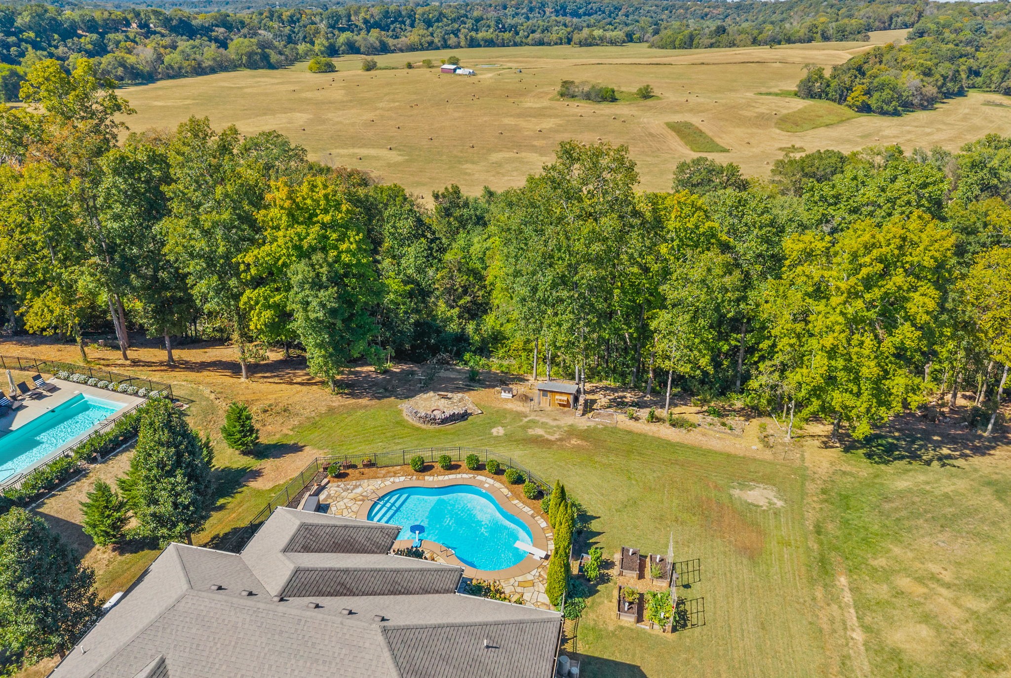 This home actually has it all: OVER ONE ACRE, BLUFF VIEWS, RED RIVER ACCESS, a HEATED INGROUND POOL, ONE-LEVEL LIVING, and NO HOA. Sellers need to move fast! If an offer is received within 10 days, sellers can offer buyers a $18,000 credit toward closing costs and a rate buydown PLUS sellers lender can give a $6000 credit for a total of $24,000 towards closing cost ! Combine that with NO CITY TAXES, and you're looking at a substantially lower monthly payment. Close in November, and your first payment won't be due until January 2027!This all-brick home in The Bluffs at Bradbury sits on 1.15 acres with ACCESS to the Red River bordering the back of the property. All bedrooms are located on the main floor, with a bonus room and flex/office space upstairs, and French doors overlook the backyard. The primary suite is tucked away with a large custom closet and spacious bathroom featuring a soaking tub, tiled shower, double vanities, and marble countertops. The laundry room offers built-in cabinetry, a double sink, and plenty of folding space. The garage also provides plenty of shelving for additional storage.Outside, the heated inground pool features an 8-foot deep end, LED lighting, and flagstone decking. There is also a screened porch with WeatherTech decking and a custom flagstone fire pit. The backyard includes a chicken coop and beautiful GARDEN BEDS, adding even more to this incredible property. A beautiful walking path winds through the property to the Red River, giving you easy access for kayaking, fishing, or simply spending time by the water.Close access to I-24 means Nashville is a short 40-minute drive away. Come take a look before it's gone!GO HERE TO VIEW THE UNBRANDED PROPERTY WEBSITE WITH EXTRA VIDEOS AND PHOTOS:https://www.relahq.com/mls/267431866