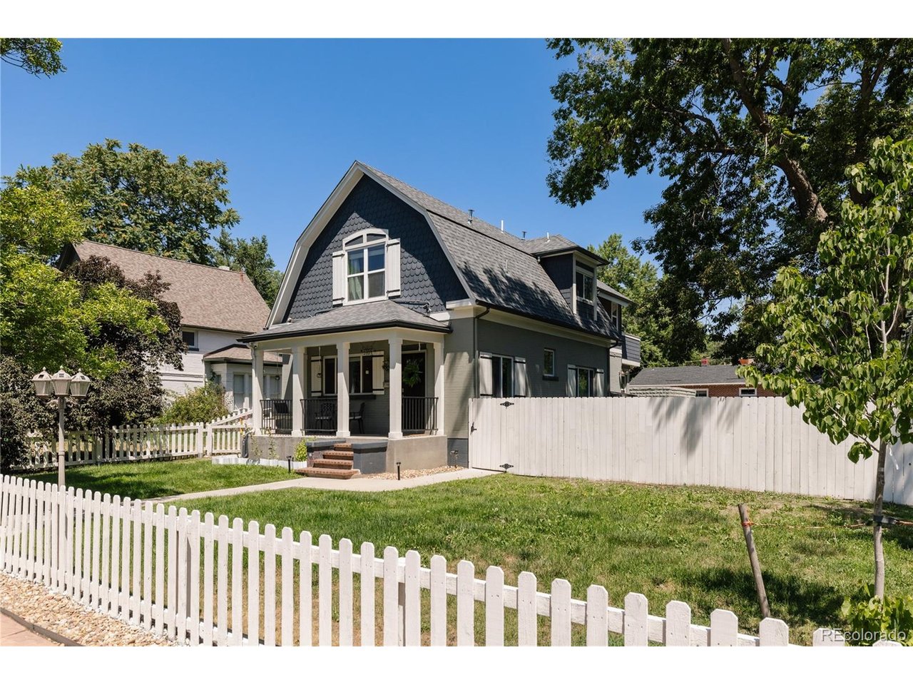 PRICE IMPROVEMENT! Now offered at $1,650,000, this is a rare find. Exceptional location, perfectly siituated near the vibrant West Highlands and Sloan's Lake border, offering rapid access to local coffee shops, eateries, and I-25 via 23rd Avenue. Rare 8,440 sq ft lot zoned ADU, FULLY fenced with an added privacy fence along the side and backyard, this corner lot delivers the quiet, private outdoor living Denver buyers dream about! A separate backyard structure with a 1/2 bath is ready to become your home office, gym, studio, or guest retreat.Inside, the updated kitchen impresses with custom white cabinetry, marble countertops, a gas cooktop island, and a built-in banquette breakfast nook with access to the yard and garden. The primary suite is a true retreat - vaulted wood clapboard ceilings, a private balcony, and a spa-caliber 5-piece marble bath with a clawfoot soaking tub.Original hardwood floors, exposed brick, and a grand staircase anchor the main level. The finished basement with its own entrance adds serious flexibility - easily add a 4th bedroom, home gym, or guest suite. Major systems upgraded: new furnace, tankless water heater, and Halo 5 whole-home water filtration.