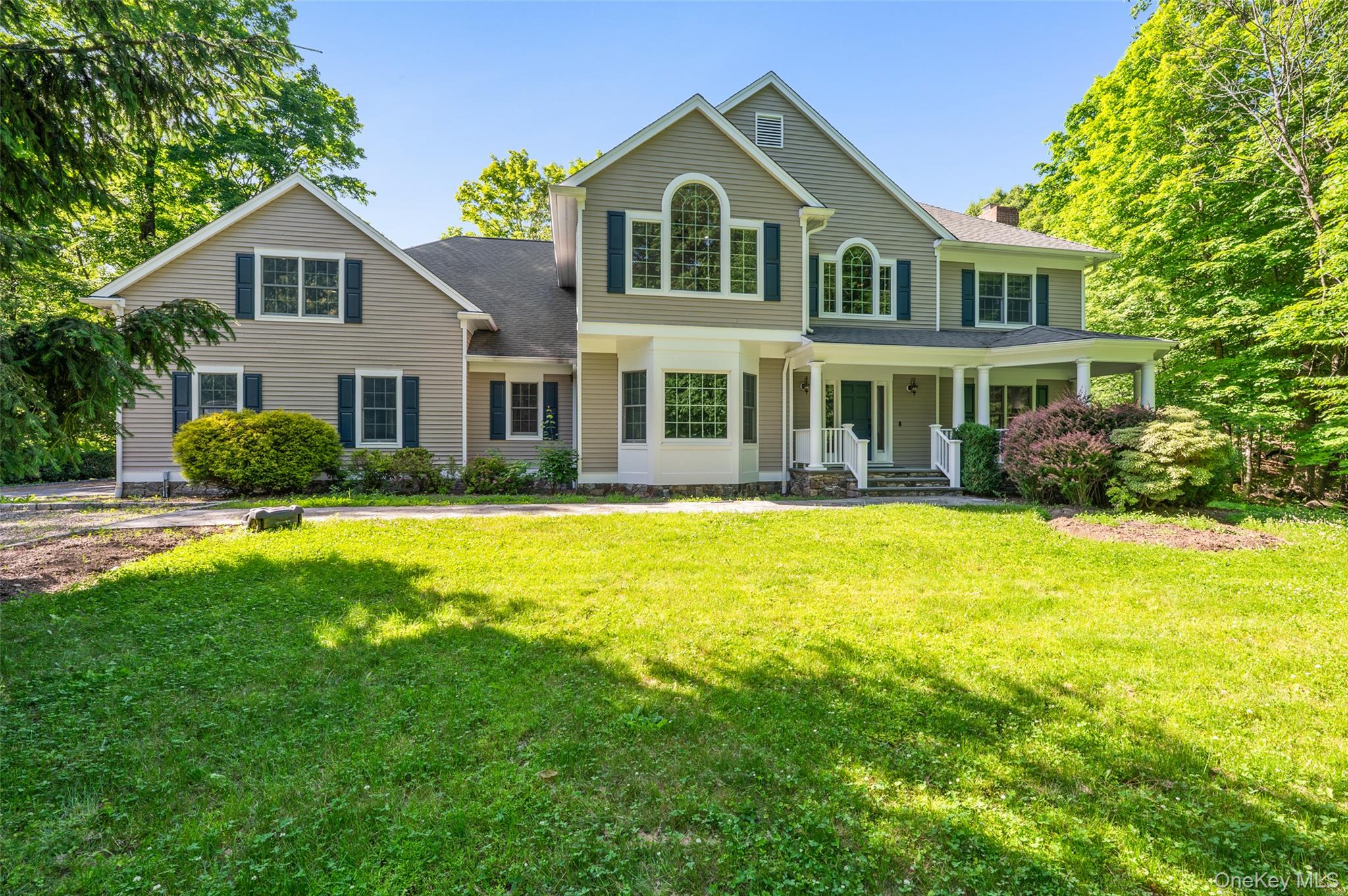 Classic elegance meets modern luxury in this stately 4-bedroom, 5-bathroom Colonial, perfectly positioned on a serene cul-de-sac prime for outdoor enjoyment. A welcoming rocking chair porch introduces the home, where you are greeted by exquisite custom millwork and crisp crown molding throughout. The sophisticated main level features a magnificent stone fireplace in the living room and a second fireplace in the inviting family room. The spectacular chef’s kitchen is complemented by a seamless butler's pantry, making grand-scale entertaining effortless. Transition outside to the private back patio, an ideal space for open-air relaxation.The expansive finished lower level is a true standout, thoughtfully designed to maximize recreation and utility. This versatile space comes complete with a dedicated theater/media room, a private wine room, a full bathroom, extensive storage rooms, and pristine mechanical housing. Experience sophisticated Bedford living with high-end finishes and a superb, functional layout.