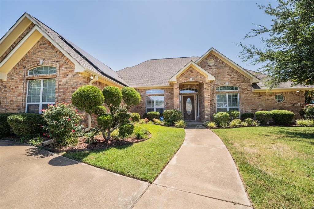 Attractive 3bed-2ba brick home in a desirable neighborhood comes with energy-efficient SOLAR PANELS! Refined details include 10-foot ceilings in living areas, crown moulding, custom windows, recessed lights, chair rail, plantation shutters, & sprinkler system for the yard. Just past the front door, you'll find a gracious formal dining on the left & a formal living area (or office) with french doors on the right. The custom kitchen has Corian countertops, breakfast bar, & walk-in pantry. A breakfast room, with access to the back patio, & formal dining room gives you extra space for entertaining guests or family. The private primary ensuite bedroom comes with trey ceiling & is split from the guest bedrooms. Thoughtful landscaping presents lots of curb appeal. A water heater was replaced in 2019 & roof replaced in 2018. At the end of the driveway, a brick detached flex room can be used as a gym, game room, extra office, etc. The tasteful interior gives you a move-in ready home!