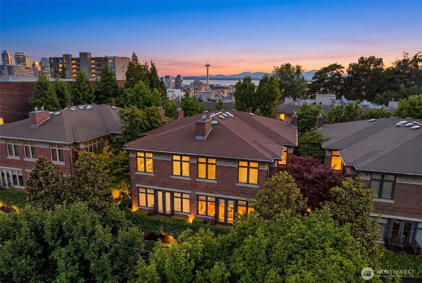 Refined elegance & effortless livability define this exceptional residence at the Harvard Estates, where timeless design meets modern convenience in one of the city's most coveted settings. Gated & tucked along a quiet street, the home offers a rare sense of calm & privacy while keeping the very best of in-city living just moments away. At the heart of the home, the gourmet kitchen is a showpiece of style & function, outfitted with high-end appliances, custom cabinetry & elegant stone surfaces that flow seamlessly into the living & dining spaces, as well as the lovely patio, ideal for both intimate evenings & effortless entertaining. Custom blinds & lighting provide modern light control at the touch of a button, while a fireplace on each level lends warmth, ambiance & a sense of quiet luxury. Upstairs you’ll find a spacious & bright second bedroom, a bathroom, & the ideal home-office. Head to the primary suite - a lavish retreat, complete with a spacious walk-in closet, 5 piece bath, & a feeling of true sanctuary. Enjoy the perfect media/rec room on the lower level, great for hosting or a relaxing movie night. Secure 2-car garage parking, private elevator access to all three levels, & an abundance of space blend architectural sophistication with everyday ease. Nearby to all the best amenities the city has to offer, this thoughtfully designed & meticulously maintained residence is the perfect home for those who value refinement, comfort & an elevated in-city lifestyle.
