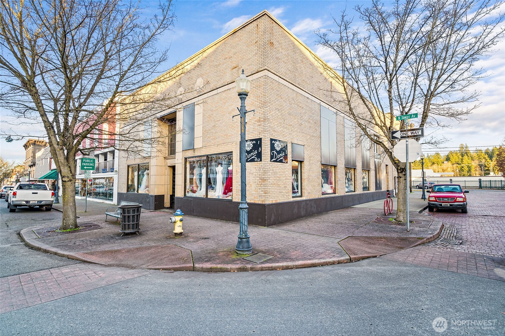 There are buildings that simply radiate charm and history. This is one of them. Proudly residing at the corner of N Tower and E Magnolia, the stately brick exterior is a stunning hallmark of the tree-lined arterial in Downtown Centralia. The original City Hall, which was then converted to a bank building, the slab on grade foundation and remaining elements of a bank vault leave no question this structure was built to last. Featuring approx. 3,000 feet of open showroom floor and an updated second level office with en suite bath, the potential uses are many. For a light-filled ambiance, open the drop ceiling and remove the metal clad window coverings for extra tall ceilings flooded with natural light. Seller financing through real estate contract with at least 25% down, 5-year balloon, other terms subject to qualifications upon approval. Own a piece of Centralia history today!