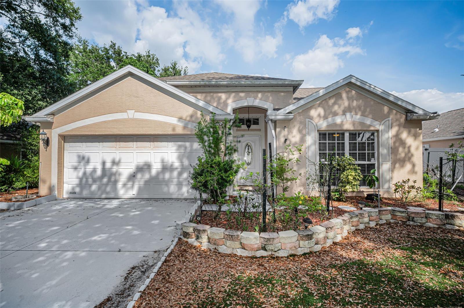 Welcome to 1721 Hunter Lane, conveniently located in the desirable Brittany Park community! This spacious open floor plan pool home features 3 bedrooms, 2 bathrooms, and a 2-car garage, offering the perfect opportunity for buyers looking to personalize and update a home while enjoying comfortable move-in-ready living from day one.  As you step inside, you’re immediately greeted by beautiful views of the sparkling pool and patio area, creating the perfect backdrop for relaxing or entertaining guests. The thoughtfully designed split-bedroom layout places two guest bedrooms toward the front of the home, while the private primary suite is tucked away in the rear and features an ensuite bath along with direct pool access. Step outside and imagine creating your own backyard oasis in the large fenced yard — ideal for gardening enthusiasts, pets, outdoor gatherings, or future custom landscaping projects. Conveniently located just minutes from Fred Howard Park, the famous Tarpon Springs Sponge Docks, local restaurants, shopping, professional offices, and entertainment, this home offers both lifestyle and location at an incredible value. Priced to sell quickly — call today to schedule your private showing before this one is SOLD!