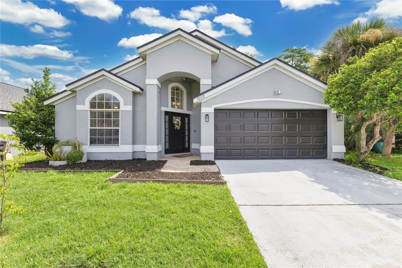 Some homes check boxes. Some leave an impression. This home does both. Set on a quiet street in an established Orlando neighborhood, this 4-bedroom home (plus a dedicated office) offers more than square footage; it strikes a balance — space to live, space to breathe, and space to bring people together. From the moment you step inside, the layout just makes sense. Vaulted ceilings in the main living area give the home an open, easy flow. Wide-plank luxury vinyl flooring runs throughout — clean, durable, and quietly stylish. The kitchen, dining, and family room all connect with ease — perfect for weekday living or a full house on the weekend. The kitchen holds its own with Samsung stainless steel appliances, granite countertops, updated lighting, and a center island with a breakfast bar where life happens: homework, meal prep, and catching up. Up front, a dedicated office with great light is nestled behind a pocket door to ensure just the right amount of quiet to focus. The split floor plan keeps the primary suite tucked away with a walk-in closet and a private bath that gets it right: double sinks, soaking tub, separate shower, and room to move. On the opposite side of the house, three more bedrooms and a full bath keep things functional without feeling crowded. Each bedroom has custom closet systems that make everyday routines smoother. But where this home really shifts gears, is out back. Step into 1,200 ft² of screened-in space that lives like a second living room. A 400 ft² covered lanai helps create a natural hub — room to lounge, room to move, room to make memories. It’s where the day winds down, where weekends come to life, and where the best conversations seem to happen when no one’s really trying. The big stuff? Already done. Roof and HVAC (2020), spray foam insulation (2021), fresh paint inside and out (2021), an Ecobee smart thermostat, and a solar panel system — all in place so you can skip the projects and start living. And the location? A quiet, low-dues community ($122/year) with quick access to everywhere you want to be. Just 12 minutes to downtown, under 10 to the airport, and close to major roads, Ventura Golf Course, Valencia, UCF, parks, and local spots. Close enough to stay connected. Far enough to truly unwind. The updates are done, the layout just works, and the backyard speaks for itself — It checks the boxes. And it leaves the impression.