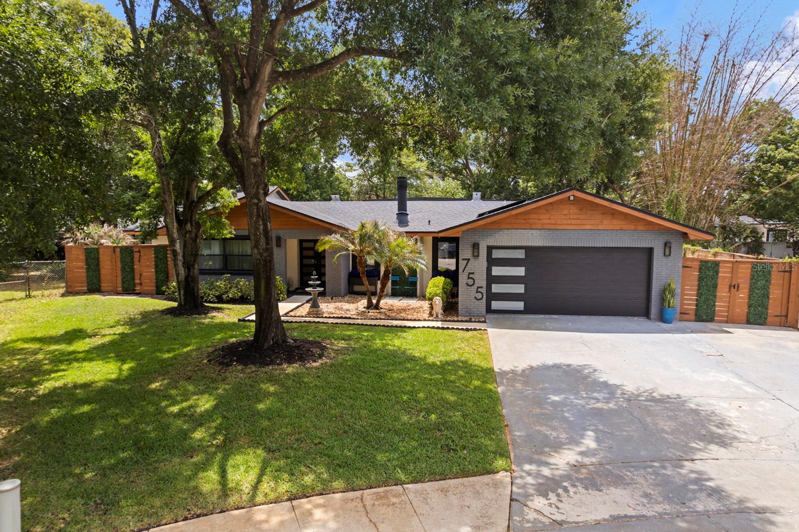 NEWLY PRICED TO SELL, UNDER APPRAISED VALUE, DO NOT MISS THIS OPPORTUNITY!! SLEEK MODERN HOME, where EVERY MAJOR SYSTEM AND FINISH has been REPLACED, REFRESHED and ELEVATED to perfection and just minutes from Winter Park. Located at 755 Woodside Road in the community of Forest Brook in Maitland with 3,054 Sq Ft. of living space, in a quiet CUL-DE- SAC, this 3 BEDROOM 3 FULL BATHROOM POOL home with 2 Car garage on a .31 ACRE LOT is effortless Florida living.**SOLAR PANELS-(Avg. utilities $40/MONTH) From the moment you arrive you will be impressed with the mature, manicured landscaping and architectural features that sets the tone for the quality you will find inside. The EXPANSIVE OPEN FLOOR PLAN draws you in with an effortless flow between living, dining, and entertaining spaces.  SLEEK MODERN CABINETRY, MARBLE FLOORING and DESIGNER FIXTURES elevate every room. The chef-inspired kitchen features a LARGE CENTER ISLAND perfect for casual dining, meal prep or gathering with guests.  A stylish PASS THROUG BAR connects seamlessly to the Florida Room making entertaining a breeze. The OVERSIZED PRIMARY SUITE is a true retreat with MARBLE FLOORING, an abundance of  natural light and CUSTOM SLIDING GLASS DOORS leading to the expansive pool deck. The en-suite bathroom features FLOATING VANITIES, MARBLE FLOORING and a SEAMLESS GLASS ENCLOSED SHOWER and STAND ALONE TUB that continues the modern aesthetic that feels like a five star hotel everyday. Laundry with sink and overhead cabinets is centrally located near the kitchen and primary suite. The focal point of the family room is the stunning MARBLE FACED FIREPLACE. Two generously sized secondary bedrooms are located off the family room, sharing a beautiful bathroom featuring marble floors, floating dual sink vanity and walk-in shower-consistent with the finishes throughout.  The Florida Room is where the fun truly begins.  Currently set up as the ultimate entertainment space, this incredible space offers endless possibilities- playroom, game room, movie room or the perfect indoor/outdoor lounge for hosting family and friends.NEW OVERSIZED WINDOWS frame spectacular views of the pool, floods the space with natural light and seamlessly connect the indoors to the out.  The THIRD FULL BATH located off the Florida Room serves as the POOL BATH with walk-in shower, Jacuzzi, floating vanity and premium finishes. This homes outdoor spaces provide something for everyone. The large, screened-in pool deck features a Tiki Bar and dedicated PROJECTOR SCREEN AREA (Screen & Tiki Bar CONVEY IN THE SALE) perfect for entertaining pool side.The side yard with artificial turf is clean, low maintenance, and pet friendly. A charming brick paver seating area creates as cozy spot to relax, unwind or let the pets roam freely. Enjoy the tranquility of this homes beautiful backyard. ADDITIONAL LIST OF UPGRADES: 2020 HARDSCAPE & LANDSCAPING, 2021 NEW WATER HEATER & POOL PUMP, 2024/2025 REPLACED LARGE AC AND DUCTWORK, AC PRIMARY SIDE UNIT, 2025 NEW FLORIDA ROOM WINDOWS, ADDED RID-O-RUST SYSTEM TO WELL FOR IRRIGATION, SCREENED IN POOL/DECK, SOLAR PANELS (to be paid off at closing) ADDED DRY BAR WITH UPPER AND LOWER CABINETS IN DINING AREA.  Conveniently located minutes away from boutique shopping, acclaimed dining and vibrant entertainment of the beautiful city of Winter Park with easy access to Orlando and surrounding communities. This home won't last long. Call your Agent to schedule a showing today!