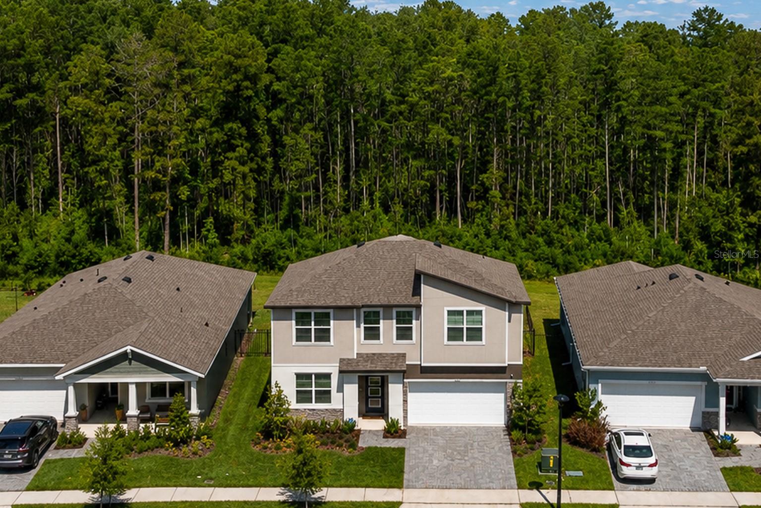 Why wait to build when you can move into a nearly new, beautifully upgraded home today? Built in 2025, this exceptional property offers the perfect blend of modern design, comfort, and convenience, already complete with upgrades that would otherwise take time and additional investment.Set on an oversized lot with no rear neighbors and peaceful conservation views, this home provides a rare sense of privacy and tranquility. With no front neighbors and a view of one of the community’s resort style pools, the location is truly special.Offering 3,086 sq ft of thoughtfully designed living space, this home features 5 bedrooms, 3 full bathrooms, and a powder room, along with a dedicated office at the front and a spacious loft upstairs. The open concept layout is ideal for both everyday living and entertaining.At the heart of the home, the upgraded Executive Kitchen package shines with modern cabinetry, beautiful countertops, backsplash, a double oven, and a microwave over the range, creating a stylish and functional space.Additional upgrades include an extended lanai, retractable screen enclosure, fenced yard, upgraded master shower, and an elegant stair banister that adds a refined touch.Move in ready and located in a highly desirable new community near top rated schools, hospitals, and restaurants, and less than 15 minutes from Lake Nona Town Center.The sellers truly love this home and are only relocating due to a job opportunity, making this a rare chance to own a like new home filled with upgrades in an incredible location.Schedule your showing today and come see it for yourself.