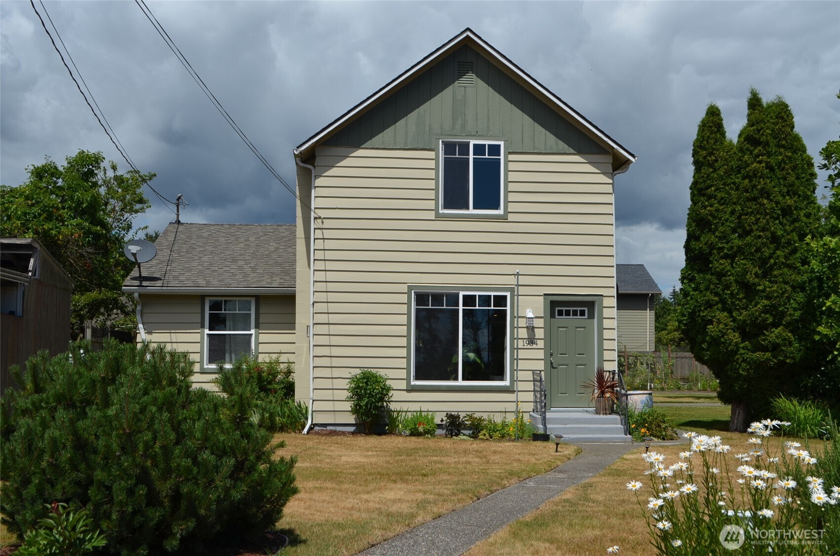 In Town Oasis!  Enjoy both country and town living with nearly ½ acre just several blocks from downtown Ferndale.  This updated two-story farmhouse offers beautiful territorial views and plenty of space for gardening, entertaining, and enjoying the outdoors.  The home features 3 bedrooms, 2 baths, enclosed carport, a shop/garage, and plenty of parking space.  Garden enthusiast will love the expansive fenced space for garden, greenhouse, and rainwater catchment system.  Raspberries, grapes, strawberries and blueberries are all established for year after year production.  Mature apple and pear trees add to the property’s country charm.    Inside, enjoy this updated home while relaxing by the gas stove and enjoying the beautiful and tranquil surroundings through the large living room picture windows.  This is a unique opportunity to enjoy the spacious landscape, convenient location to town, highway, schools, parks and developmental opportunities this property provides.