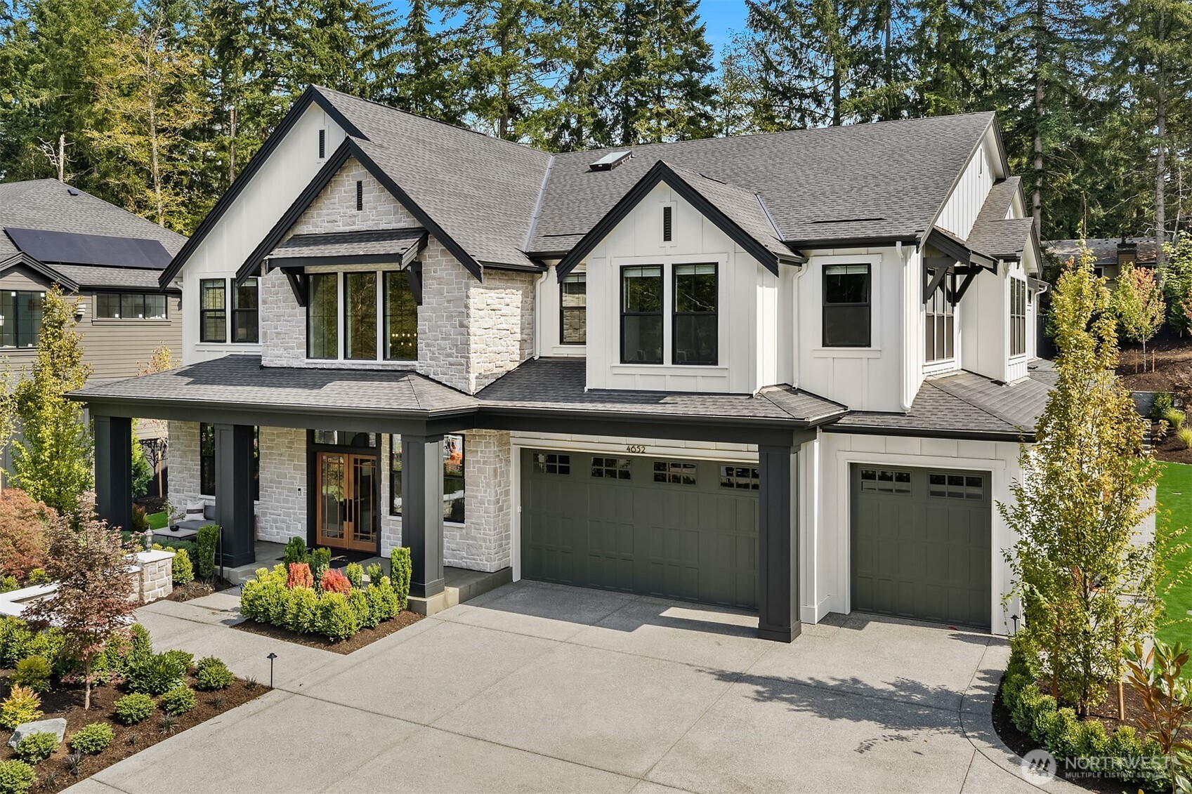 Introducing The East Haven by Murray Franklyn, located in the prestigious new signature neighborhood, The Waterford at Bridle Trails. This exclusive gated community features just nine estate-style residences on expansive homesites, offering privacy, elegance, and refined Northwest living. The East Haven plan embodies timeless sophistication with thoughtfully curated design elements throughout. A grand two-story foyer creates a striking first impression, leading to beautifully appointed living spaces designed for both comfort and entertaining. The home offers five spacious bedrooms and six bathrooms, including a luxurious main-floor guest suite complete with a five-piece en suite bath and its own private covered patio. The light-filled family room seamlessly extends to a generous covered outdoor living area with a fireplace—perfect for year-round gatherings. At the heart of the home, the gourmet kitchen features an expansive island, a separate prep kitchen, and a dedicated grilling patio plus wine room, making entertaining effortless and elegant. Upstairs, the exquisite primary suite offers a serene sitting area, a spa-inspired en suite bath, and an impressive walk-in closet designed for both function and luxury. A massive recreation room provides the ultimate flex space for movie nights, game days, and endless fun. Set on an expansive 24,941-square-foot homesite, this property delivers exceptional space and privacy for outdoor entertaining, recreation, and everyday enjoyment.